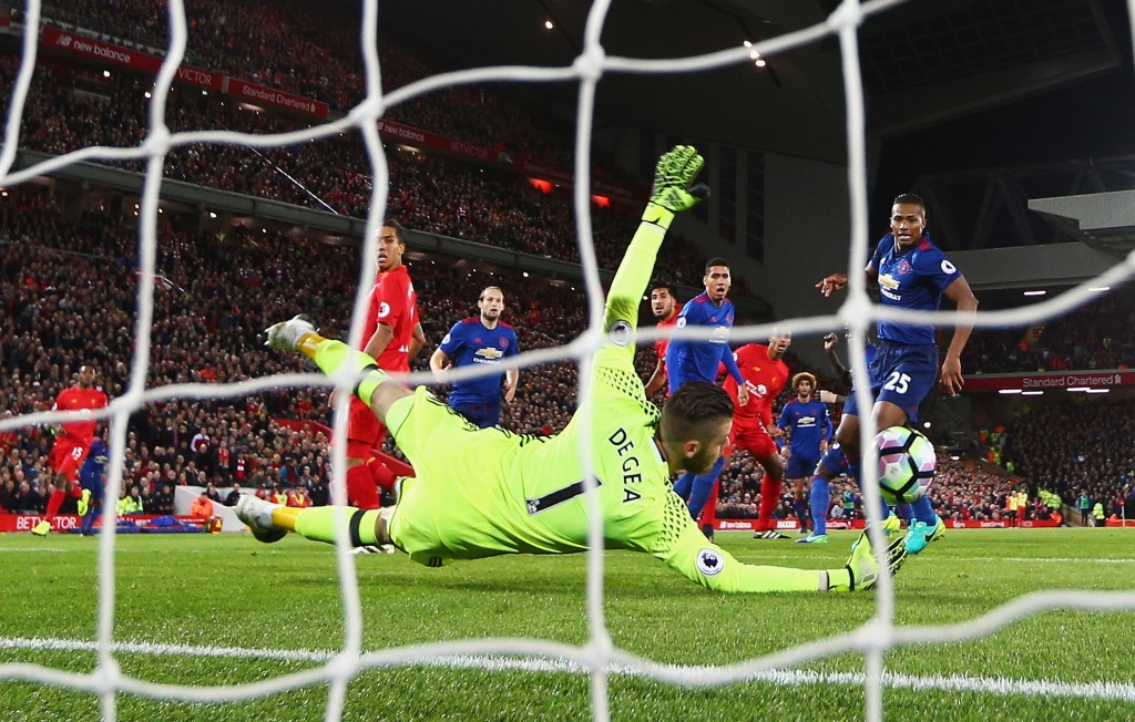 LIVERPOOL, ENGLAND - OCTOBER 17: David De Gea of Manchester United saves from Emre Can of Liverpool during the Premier League match between Liverpool and Manchester United at Anfield on October 17, 2016 in Liverpool, England. (Photo by Clive Brunskill/Getty Images)