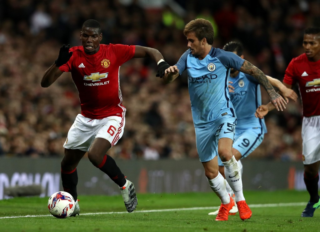 MANCHESTER, ENGLAND - OCTOBER 26: Paul Pogba of Manchester United (L) takes on Aleix Garcia of Manchester City (R) during the EFL Cup fourth round match between Manchester United and Manchester City at Old Trafford on October 26, 2016 in Manchester, England. (Photo by David Rogers/Getty Images)