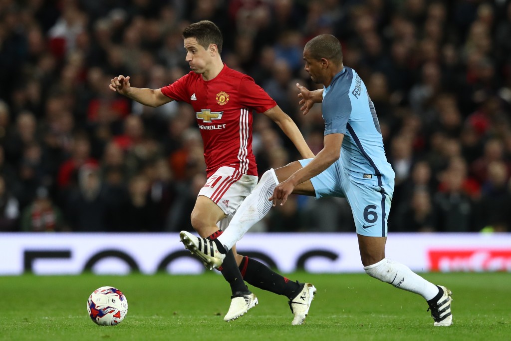MANCHESTER, ENGLAND - OCTOBER 26: Ander Herrera of Manchester United (L) takes the ball past Fernando of Manchester City (R) during the EFL Cup fourth round match between Manchester United and Manchester City at Old Trafford on October 26, 2016 in Manchester, England. (Photo by David Rogers/Getty Images)