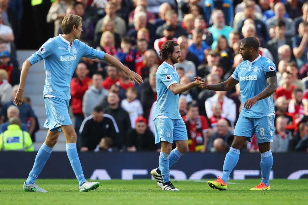 MANCHESTER, ENGLAND - OCTOBER 02: Joe Allen of Stoke City (C) celebrates scoring his sides first goal with his team mate Glen Johnson of Stoke City (R) during the Premier League match between Manchester United and Stoke City at Old Trafford on October 2, 2016 in Manchester, England. (Photo by Clive Brunskill/Getty Images)