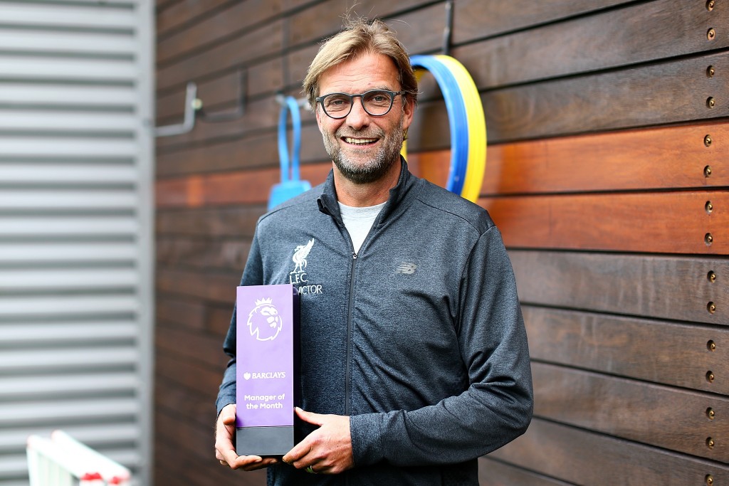 LIVERPOOL, ENGLAND - OCTOBER 13: Jurgen Klopp poses with the manager of the month trophy at Melwood Training Ground on October 13, 2016 in Liverpool, England. (Photo by Jan Kruger/Getty Images for Premier League)