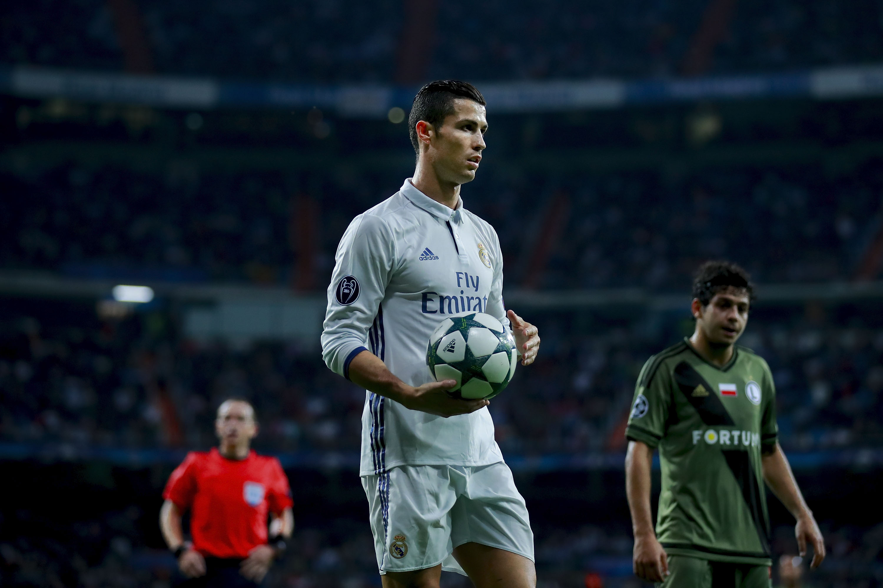MADRID, SPAIN - OCTOBER 18: Cristiano Ronaldo of Real Madrid CF holds the ball during the UEFA Champions League group F match between Real Madrid CF and Legia Warszawa at Santiago Bernabeu stadium on October 18, 2016 in Madrid, Spain. (Photo by Gonzalo Arroyo Moreno/Getty Images)
