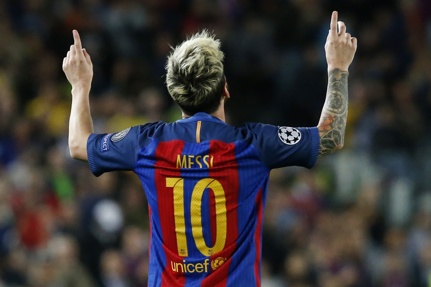 TOPSHOT - Barcelona's Argentinian forward Lionel Messi celebrates a goal during the UEFA Champions League football match FC Barcelona vs Manchester City at the Camp Nou stadium in Barcelona on October 19, 2016.  / AFP / PAU BARRENA        (Photo credit should read PAU BARRENA/AFP/Getty Images)
