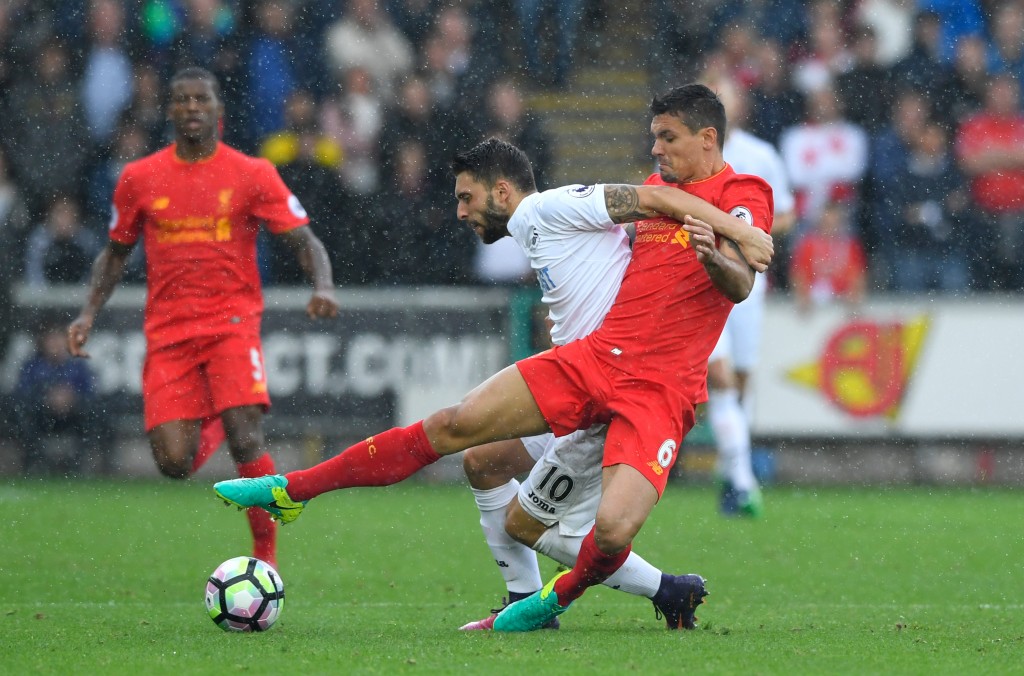 SWANSEA, WALES - OCTOBER 01: Borja Gonzalez of Swansea City (L) and Dejan Lovren of Liverpool (R) battle for possession during the Premier League match between Swansea City and Liverpool at Liberty Stadium on October 1, 2016 in Swansea, Wales. (Photo by Stu Forster/Getty Images)