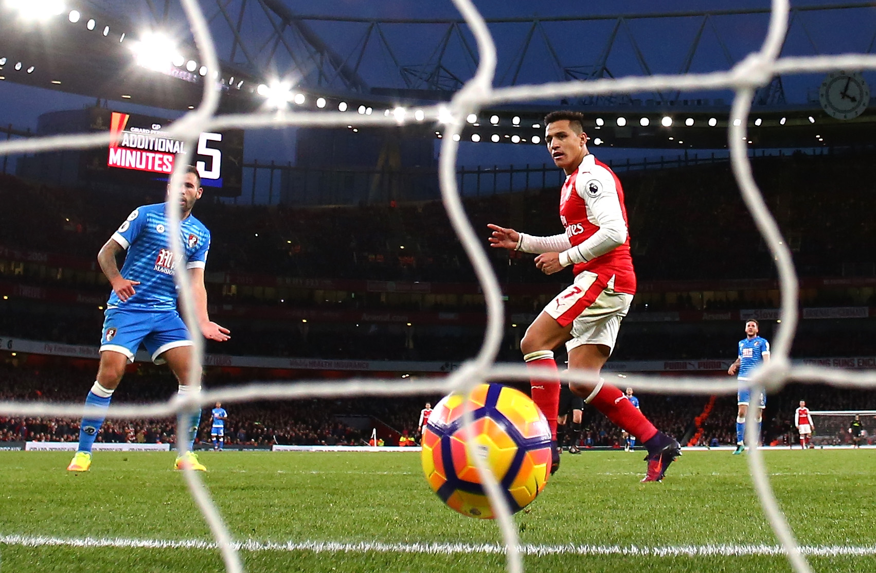 LONDON, ENGLAND - NOVEMBER 27: Alexis Sanchez of Arsenal scores his sides third goal during the Premier League match between Arsenal and AFC Bournemouth at Emirates Stadium on November 27, 2016 in London, England. (Photo by Clive Rose/Getty Images)