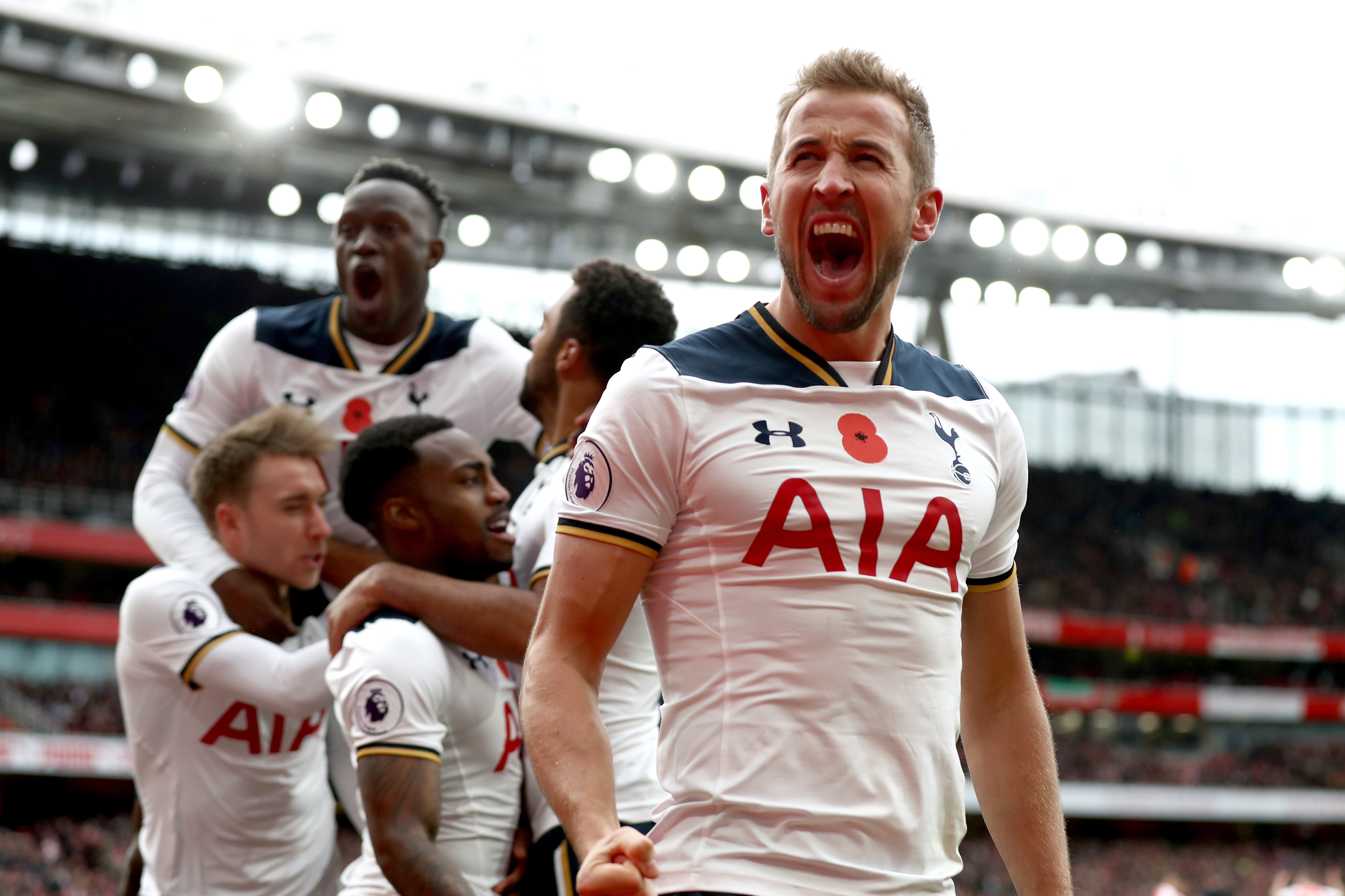 LONDON, ENGLAND - NOVEMBER 06: Harry Kane of Tottenham Hotspur celebrates scoring his sides first goal with team mates during the Premier League match between Arsenal and Tottenham Hotspur at Emirates Stadium on November 6, 2016 in London, England. (Photo by Clive Rose/Getty Images)