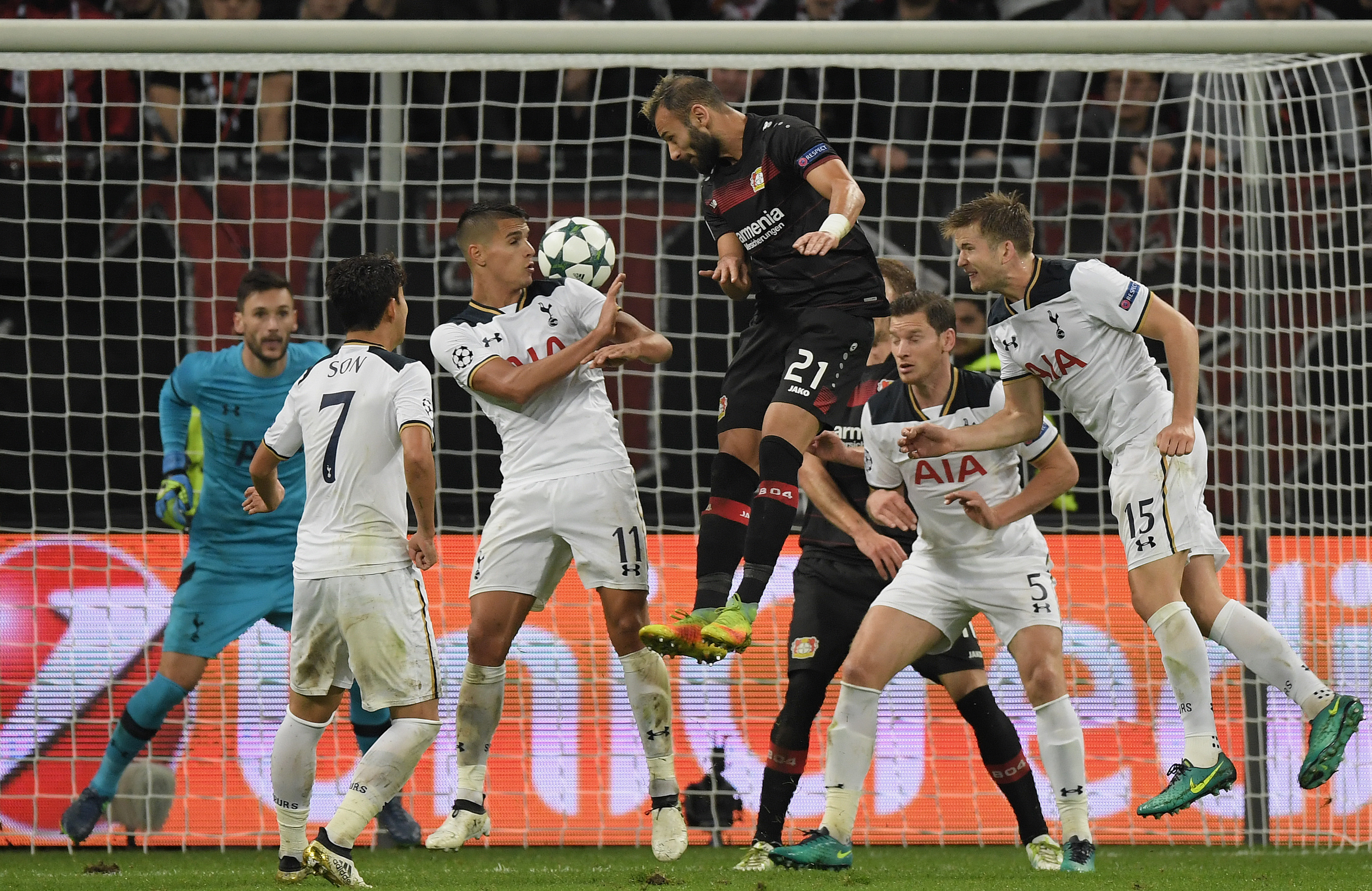 LEVERKUSEN, GERMANY - OCTOBER 18: Oemer Toprak of Leverkusen jumps for a header with Erik Lamela of Tottenham during the UEFA Champions League match between Bayer 04 Leverkusen and Tottenham Hotspur FC at BayArena on October 18, 2016 in Leverkusen, North Rhine-Westphalia. (Photo by Matthias Hangst/Bongarts/Getty Images)