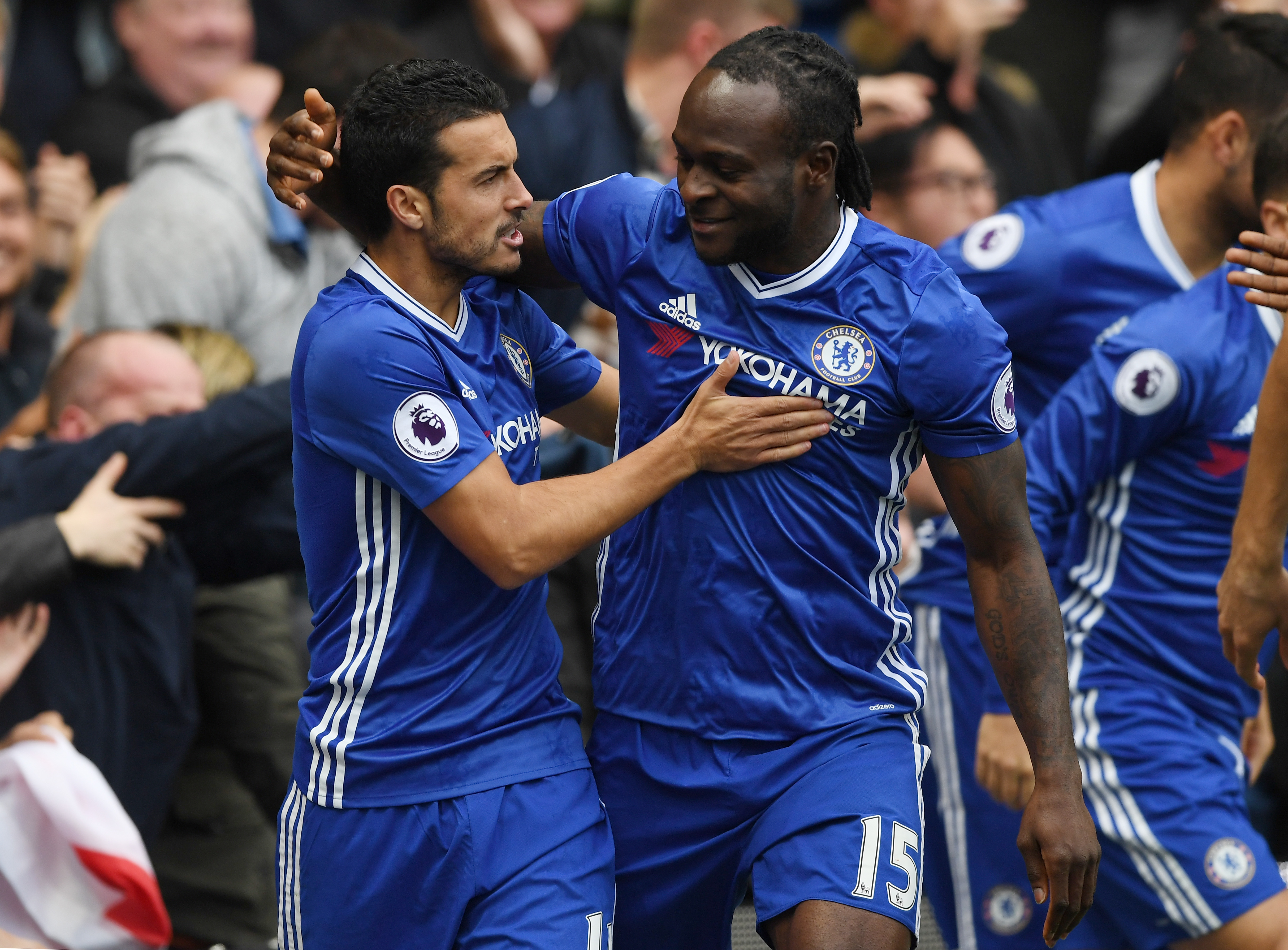 LONDON, ENGLAND - OCTOBER 23:  Pedro of Chelsea celebrates scoring his sides first goal with Victor Moses of Chelsea during the Premier League match between Chelsea and Manchester United at Stamford Bridge on October 23, 2016 in London, England.  (Photo by Shaun Botterill/Getty Images)