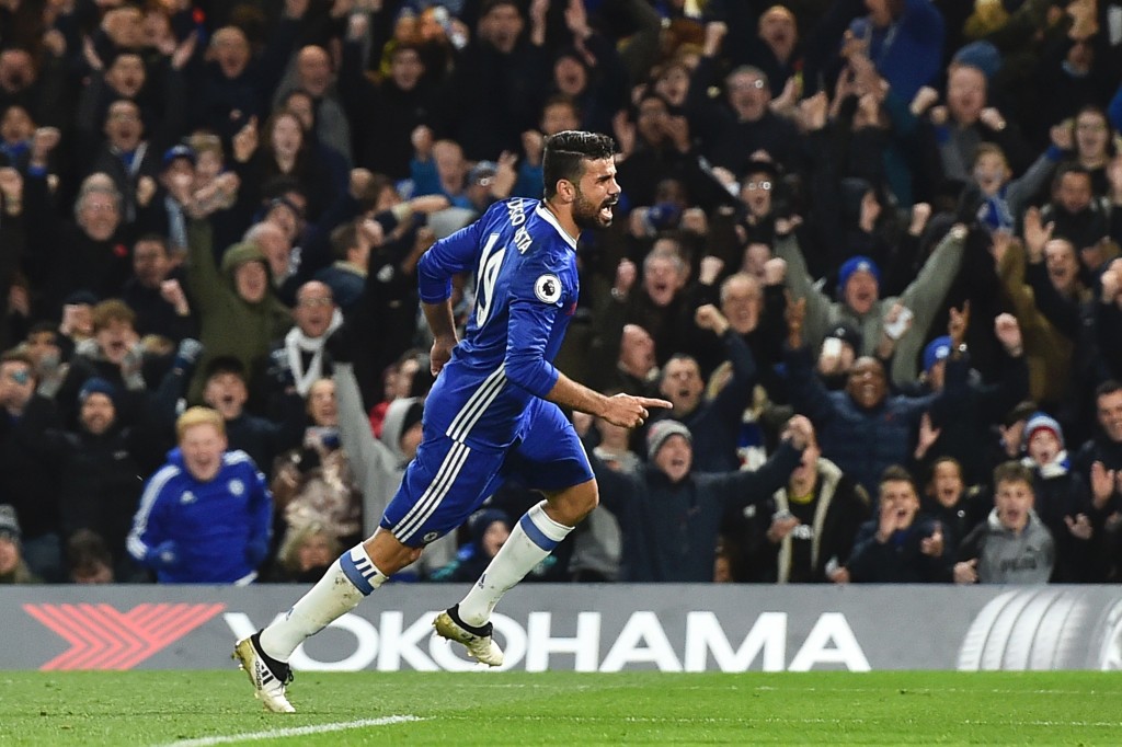 Chelsea's Brazilian-born Spanish striker Diego Costa celebrates after scoring their third goal during the English Premier League football match between Chelsea and Everton at Stamford Bridge in London on November 5, 2016. / AFP / Glyn KIRK / RESTRICTED TO EDITORIAL USE. No use with unauthorized audio, video, data, fixture lists, club/league logos or 'live' services. Online in-match use limited to 75 images, no video emulation. No use in betting, games or single club/league/player publications. / (Photo credit should read GLYN KIRK/AFP/Getty Images)