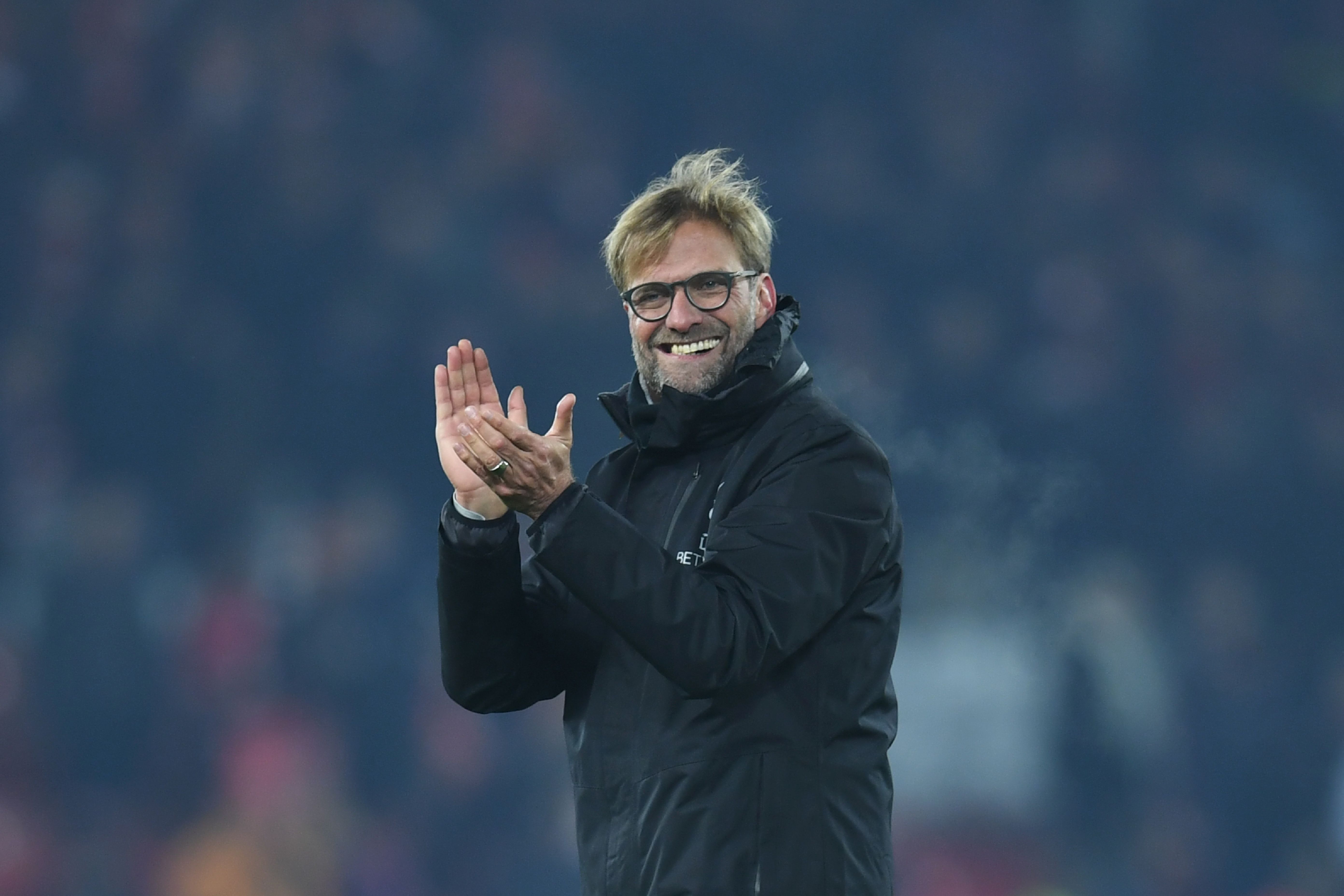 Liverpool's German manager Jurgen Klopp gestures to the crowd at the end of the English Premier League football match between Liverpool and Sunderland at Anfield in Liverpool, north west England on November 26, 2016. / AFP / Paul ELLIS / RESTRICTED TO EDITORIAL USE. No use with unauthorized audio, video, data, fixture lists, club/league logos or 'live' services. Online in-match use limited to 75 images, no video emulation. No use in betting, games or single club/league/player publications. / (Photo credit should read PAUL ELLIS/AFP/Getty Images)