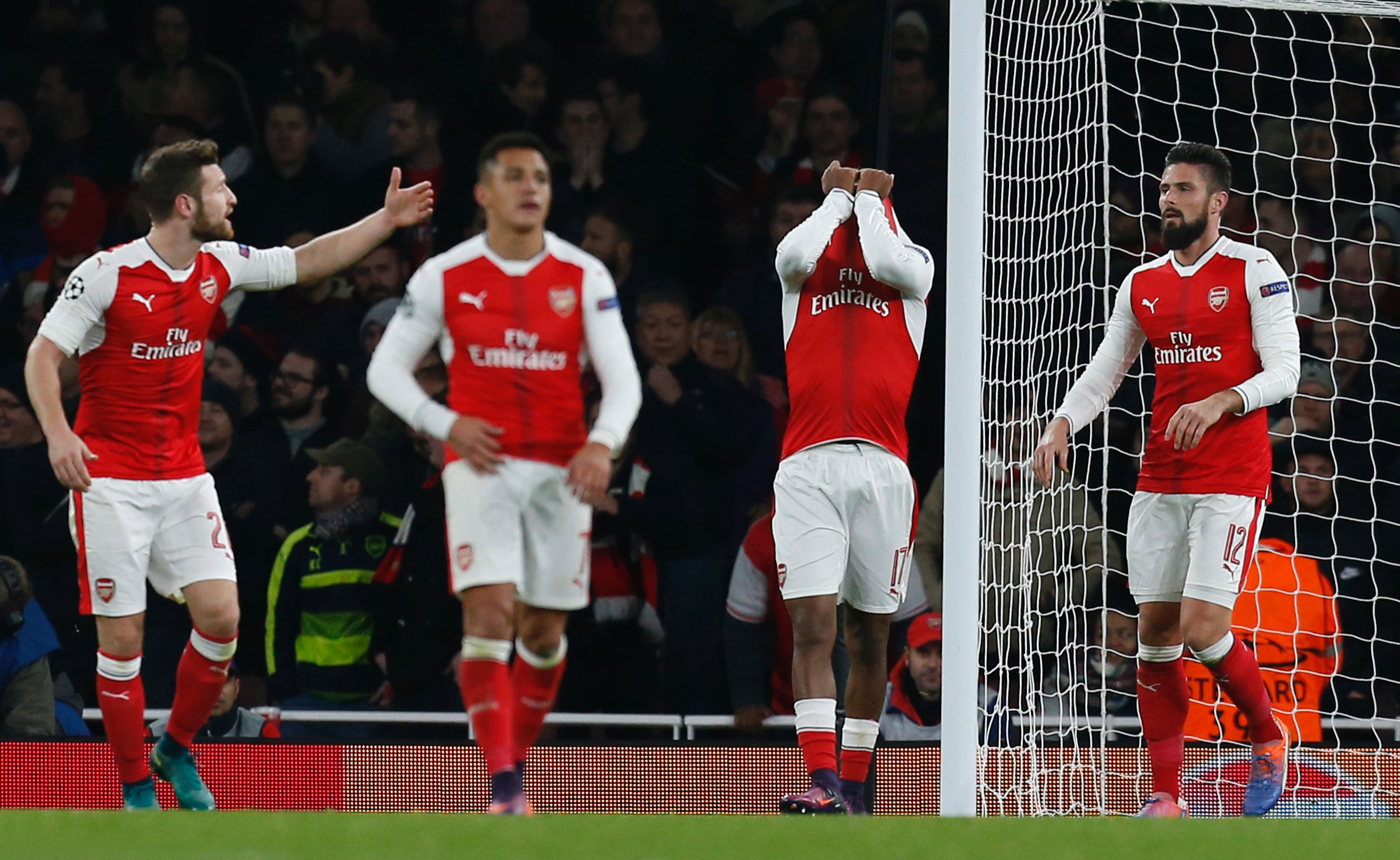 Arsenal's Nigerian striker Alex Iwobi (2R) reacts after deflecting the ball from Paris Saint-Germain's Brazilian midfielder Lucas Moura's header for Paris's second goal during the UEFA Champions League group A football match between Arsenal and Paris Saint-Germain at the Emirates Stadium in London on November 23, 2016. / AFP / IKIMAGES / Ian KINGTON (Photo credit should read IAN KINGTON/AFP/Getty Images)