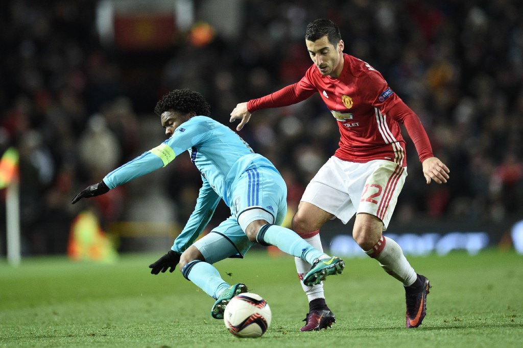 Manchester United's Armenian midfielder Henrikh Mkhitaryan (R) challenges Feyenoord's Dutch defender Miquel Nelom (L) during the UEFA Europa League group A football match between Manchester United and Feyenoord at Old Trafford stadium in Manchester, north-west England, on November 24, 2016. / AFP / Oli SCARFF (Photo credit should read OLI SCARFF/AFP/Getty Images)