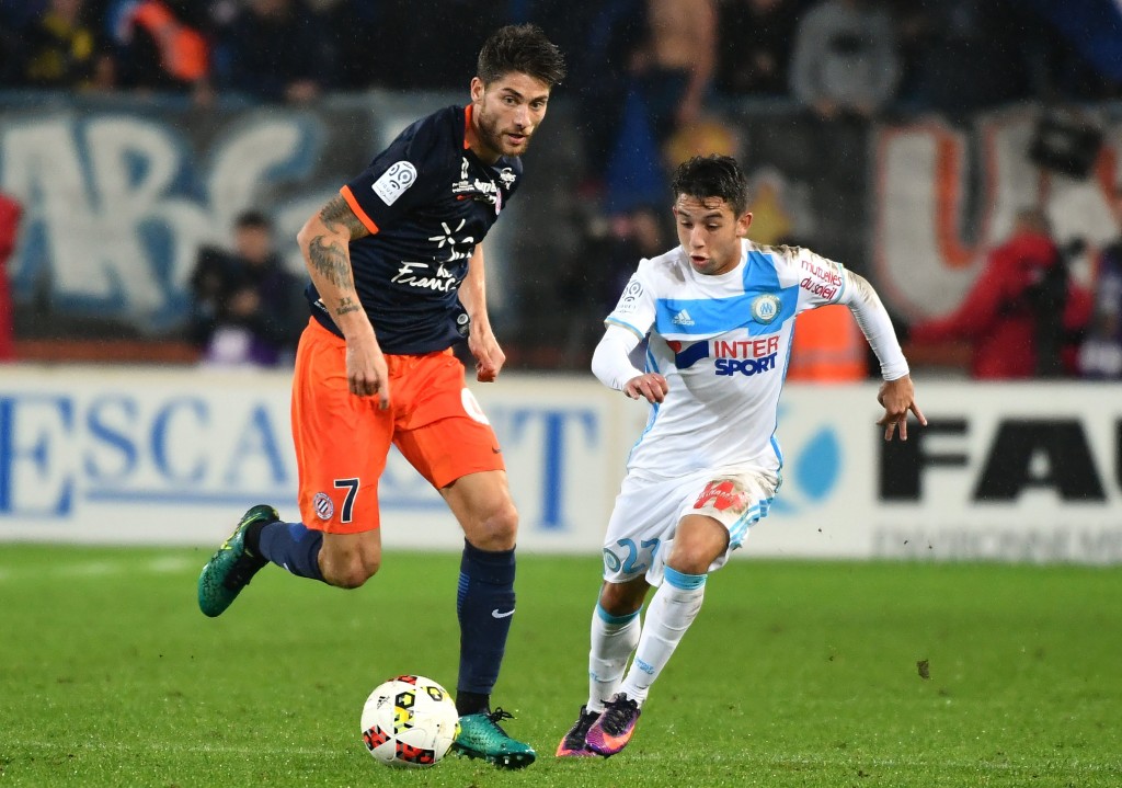 Montpellier's French midfielder Paul Lasne (L) vies with Olympique de Marseille's French midfielder Maxime Lopez during the French L1 football match between Montpellier and Marseille at the La Mosson Stadium in Montpellier, southern France, on November 4, 2016. (Photo by PASCAL GUYOT/AFP/Getty Images)