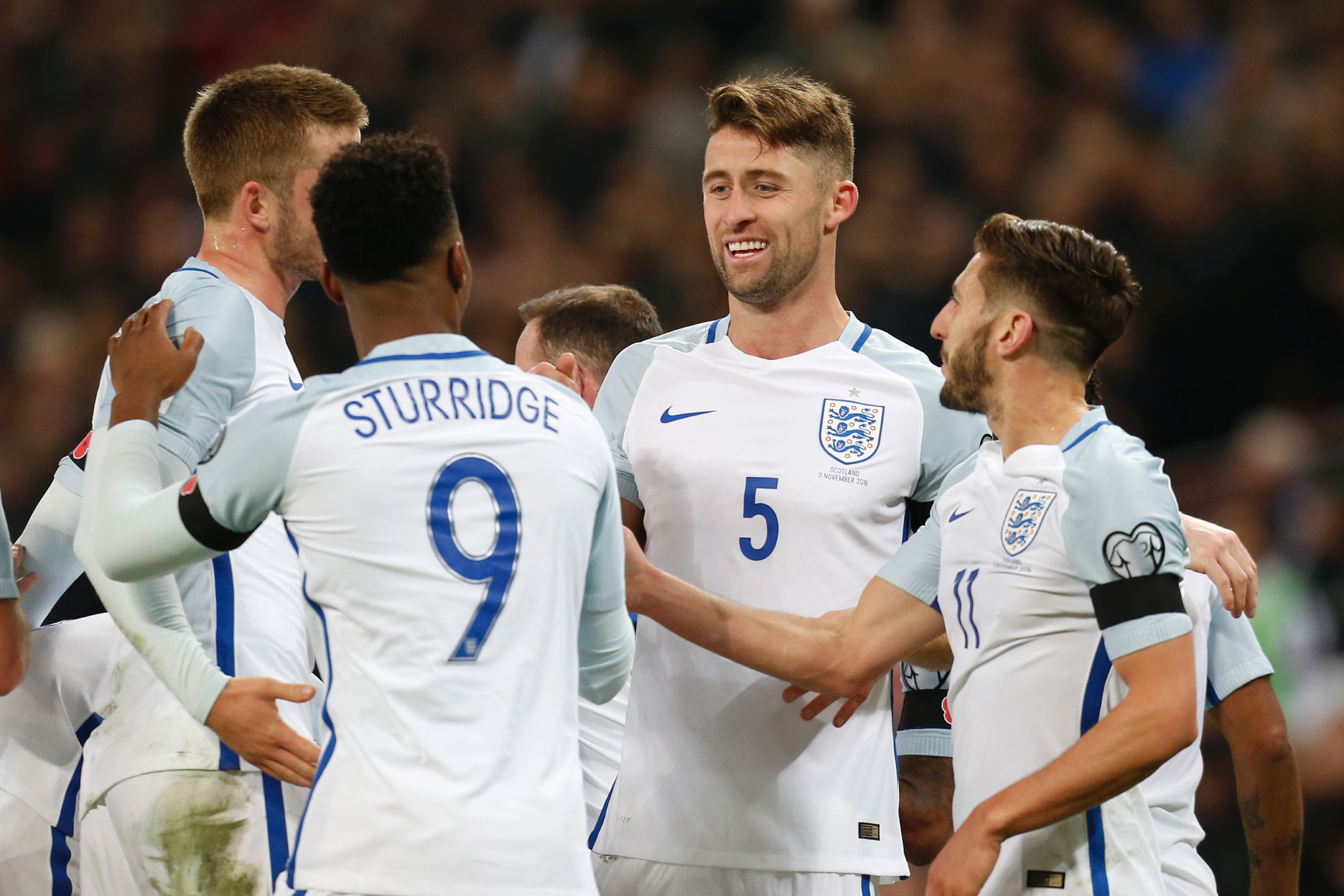 England's defender Gary Cahill (C) celebrates with teammates after scoring their third goal during a World Cup 2018 qualification match between England and Scotland at Wembley stadium in London on November 11, 2016. / AFP / Ian Kington / NOT FOR MARKETING OR ADVERTISING USE / RESTRICTED TO EDITORIAL USE
        (Photo credit should read IAN KINGTON/AFP/Getty Images)