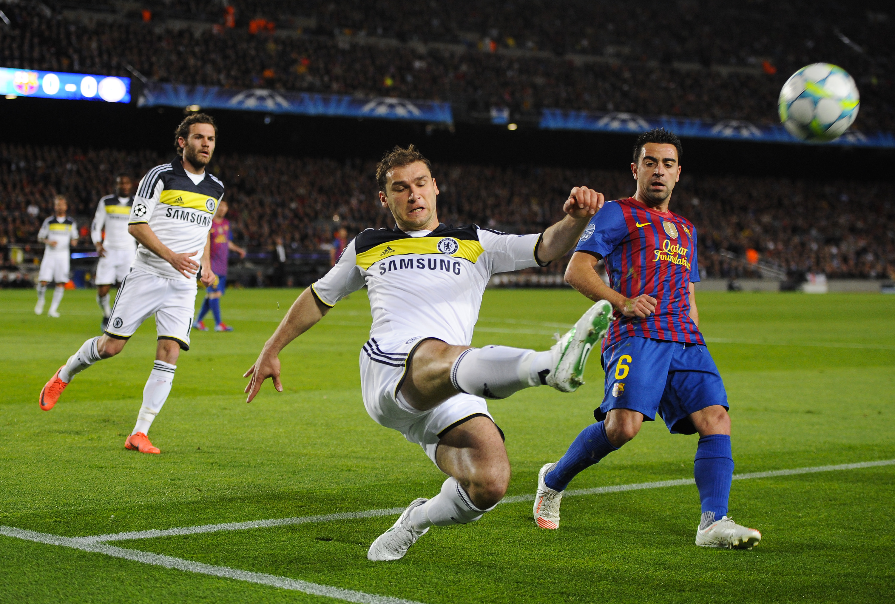 BARCELONA, SPAIN - APRIL 24: Branislav Ivanovic of Chelsea (C) in action against Xavi Hernandez of FC Barcelona during the UEFA Champions League Semi Final, second leg match between FC Barcelona and Chelsea FC at Camp Nou on April 24, 2012 in Barcelona, Spain. (Photo by David Ramos/Getty Images)