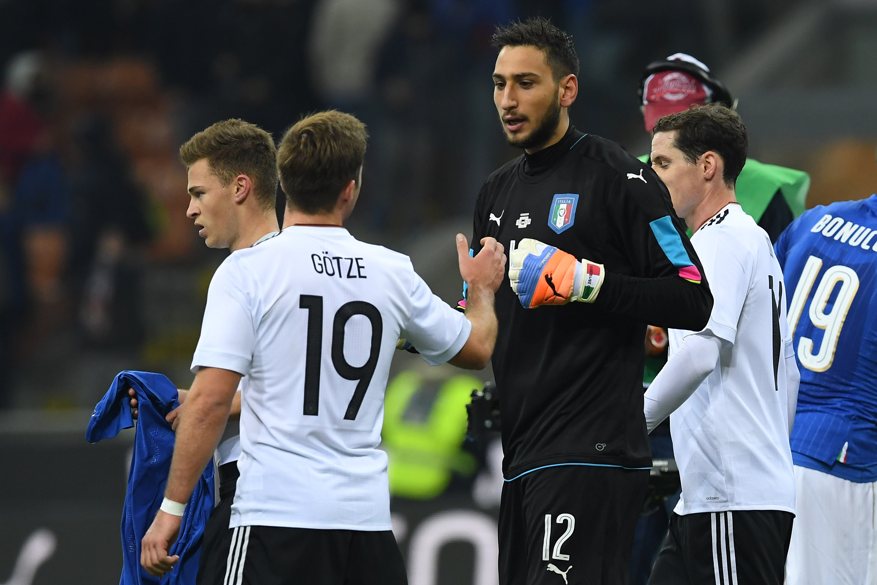 MILAN, ITALY - NOVEMBER 15: Gianluigi Donnarumma of Italy and Mario Gotze of Germany during the International Friendly Match between Italy and Germany at Giuseppe Meazza Stadium on November 15, 2016 in Milan, Italy. (Photo by Valerio Pennicino/Getty Images)