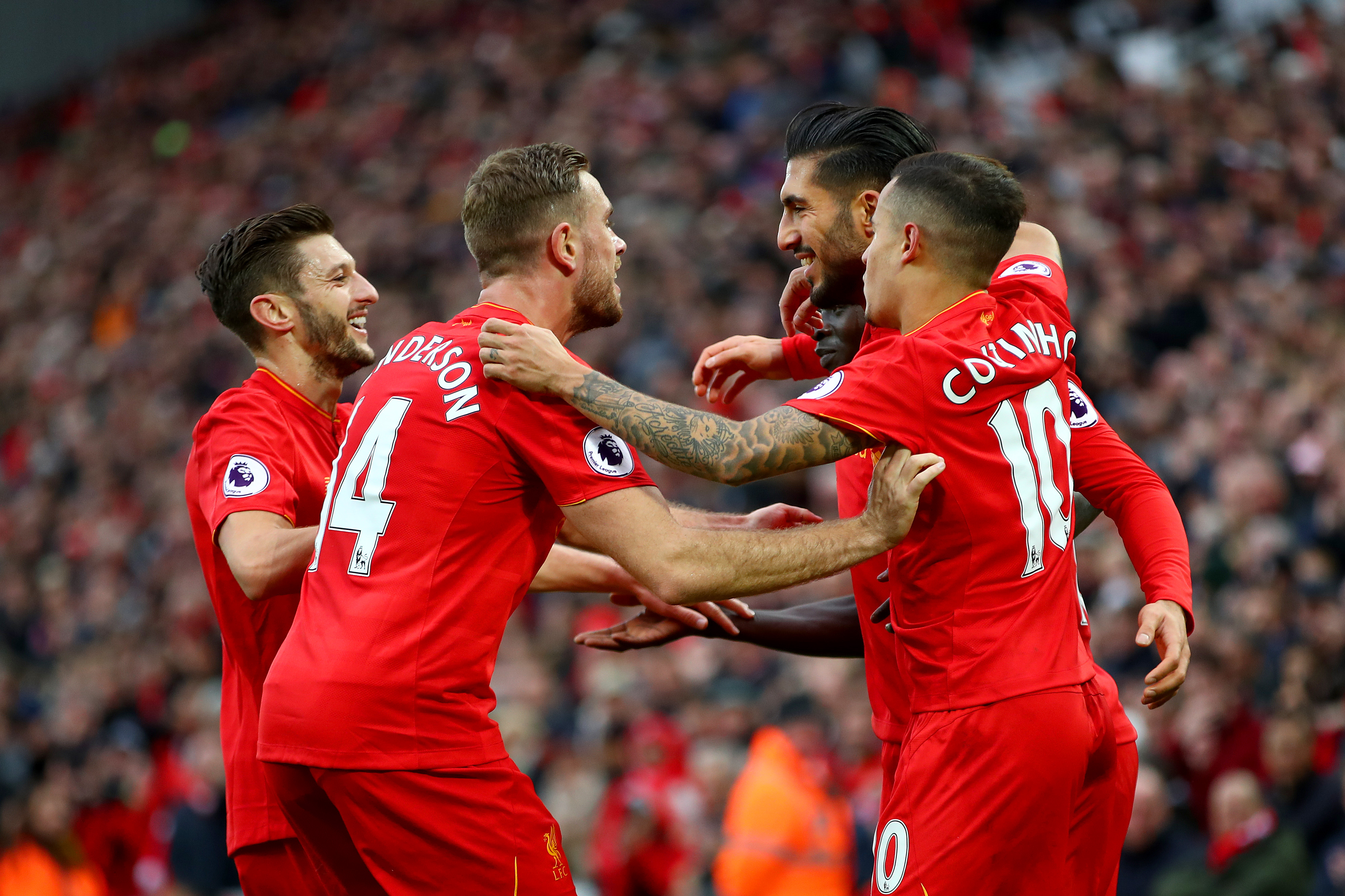 LIVERPOOL, ENGLAND - NOVEMBER 06: Emre Can of Liverpool celebrates scoring his sides third goal with team mates during the Premier League match between Liverpool and Watford at Anfield on November 6, 2016 in Liverpool, England.  (Photo by Clive Brunskill/Getty Images)