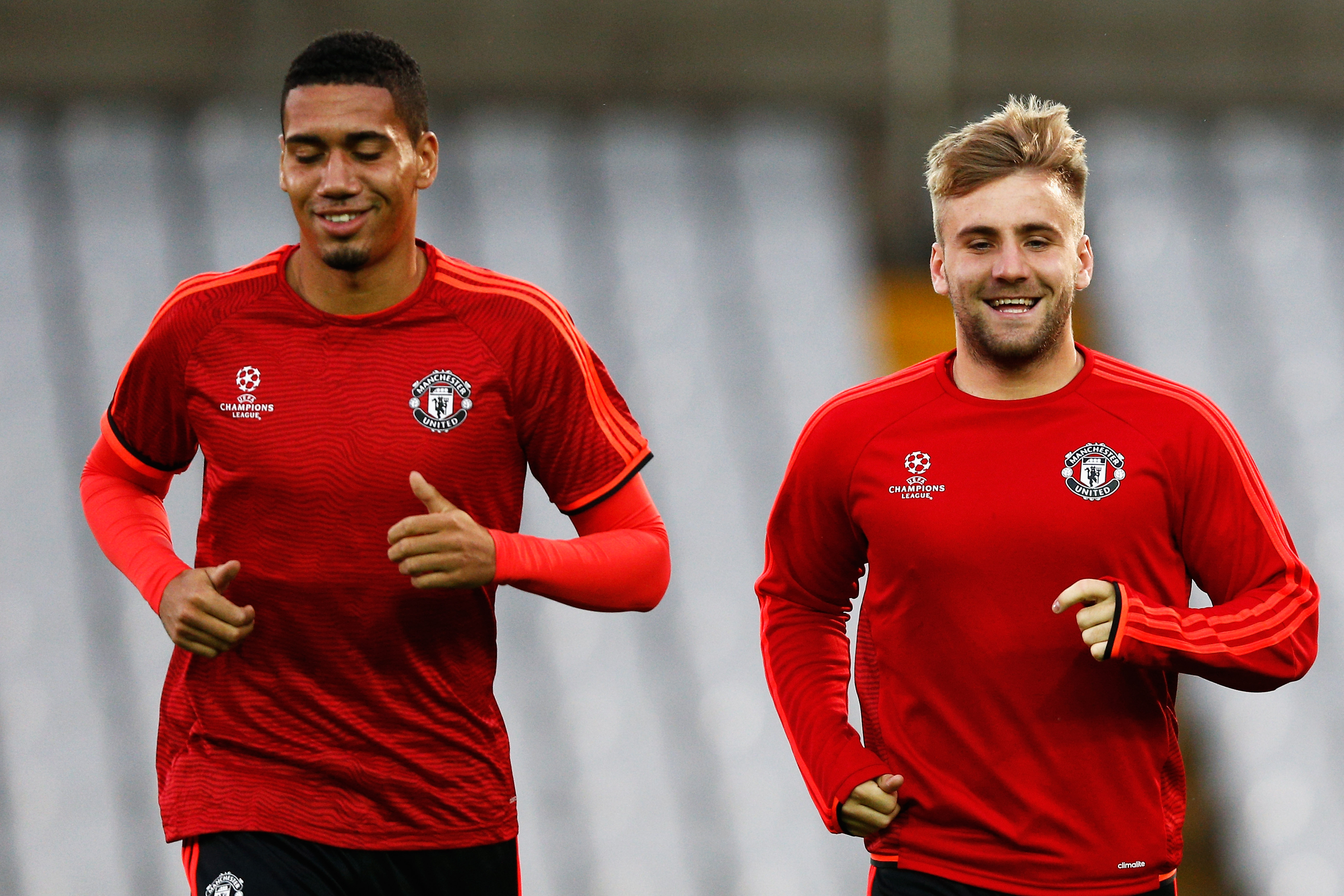 BRUGGE, BELGIUM - AUGUST 25: Chris Smalling and Luke Shaw of Manchester United warm up during the Manchester United training session held at Jan Breydel Stadium on August 25, 2015 in Brugge, Belgium. (Photo by Dean Mouhtaropoulos/Getty Images)
