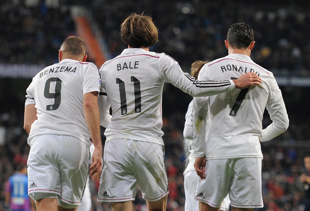 MADRID, SPAIN - MARCH 15: Gareth Bale of Real Madrid celebrates with Cristiano Ronaldo and Karim Benzema after scoring Real's opening goal during the La Liga match between Real Madrid CF and Levante UD at Estadio Santiago Bernabeu on March 15, 2015 in Madrid, Spain. (Photo by Denis Doyle/Getty Images)