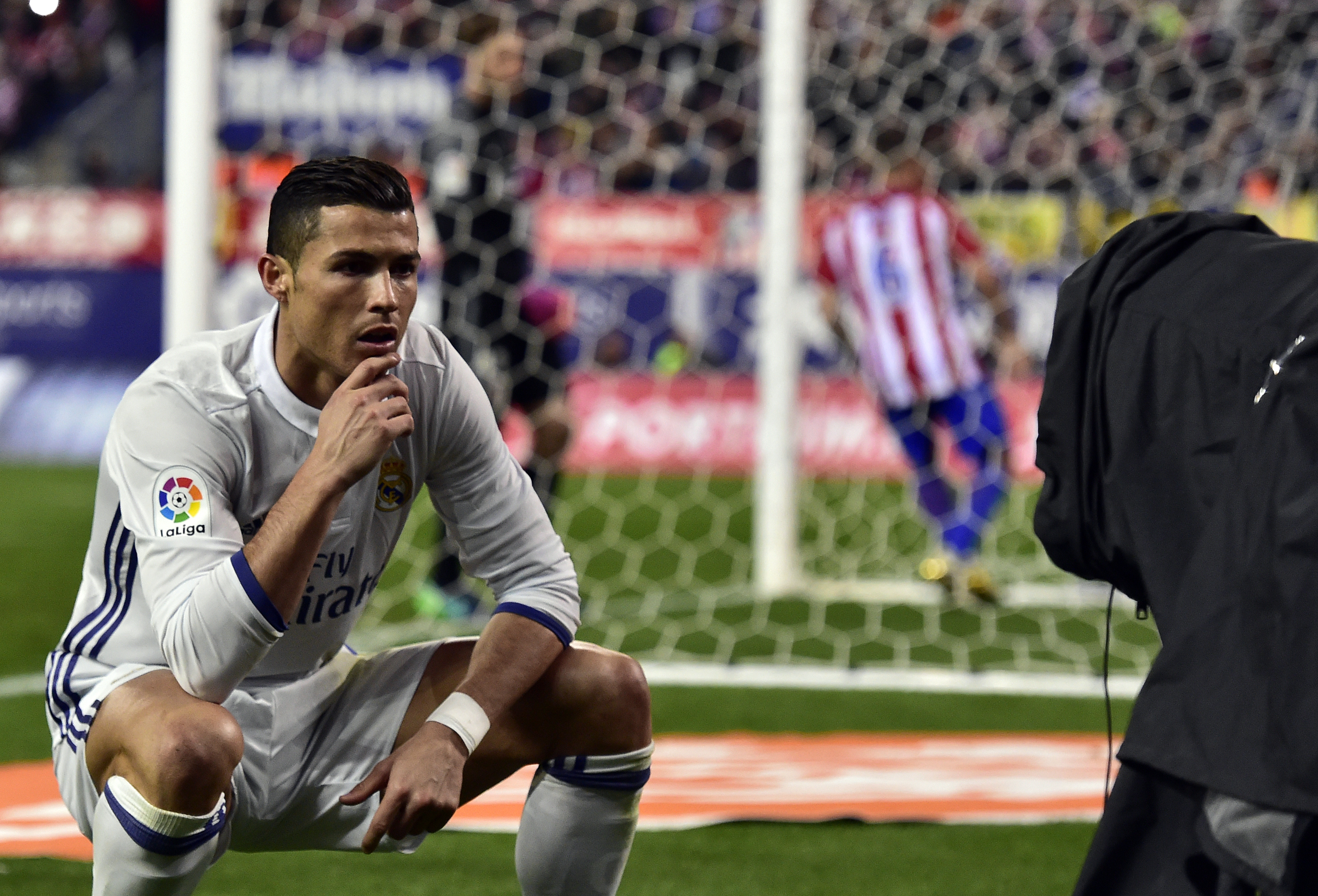 TOPSHOT - Real Madrid's Portuguese forward Cristiano Ronaldo poses in front of a TV camera as he celebrates after scoring during the Spanish league football match Club Atletico de Madrid vs Real Madrid CF at the Vicente Calderon stadium in Madrid, on November 19, 2016.
Real Madrid won 3-0. / AFP / GERARD JULIEN (Photo credit should read GERARD JULIEN/AFP/Getty Images)