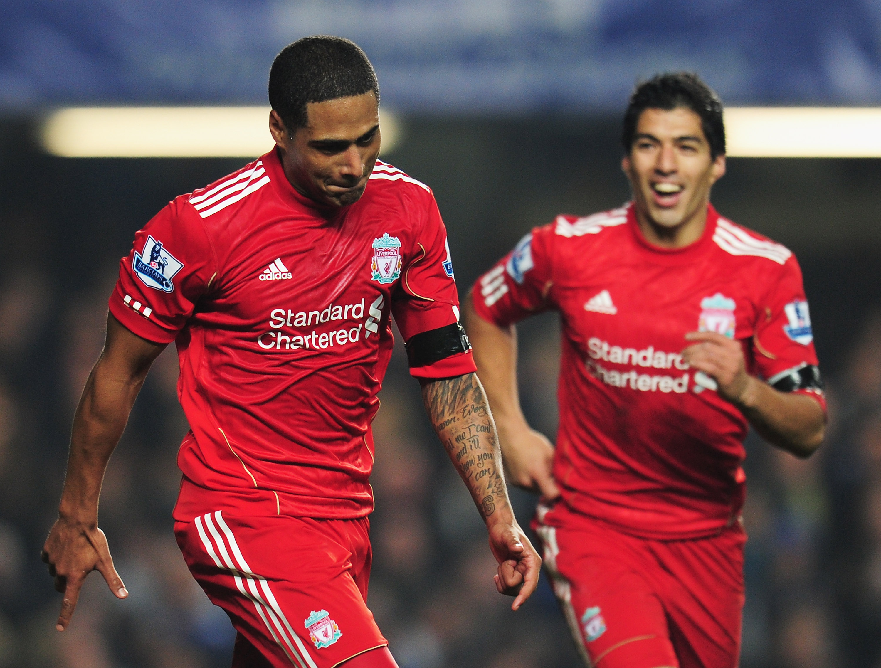 LONDON, ENGLAND - NOVEMBER 20: Glen Johnson (L) of Liverpool celebrates his goal with Luis Suarez during the Barclays Premier League match between Chelsea and Liverpool at Stamford Bridge on November 20, 2011 in London, England. (Photo by Shaun Botterill/Getty Images)