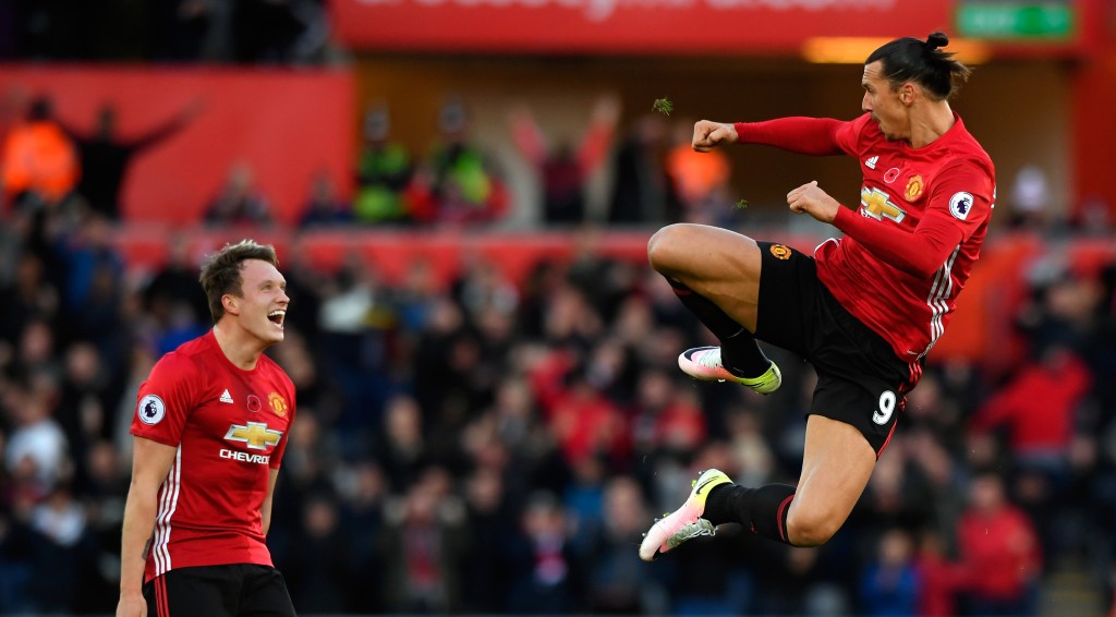 SWANSEA, WALES - NOVEMBER 06: : Zlatan Ibrahimovic of Manchester United celebrates scoring his sides second goal with Phil Jones (l) during the Premier League match between Swansea City and Manchester United at Liberty Stadium on November 6, 2016 in Swansea, Wales. (Photo by Stu Forster/Getty Images)