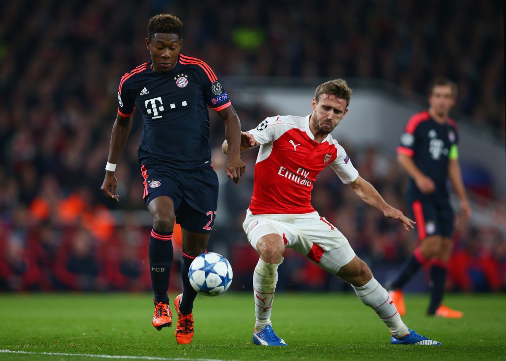 LONDON, ENGLAND - OCTOBER 20: David Alaba of Bayern Munich evades Nacho Monreal of Arsenal during the UEFA Champions League Group F match between Arsenal FC and FC Bayern Munchen at Emirates Stadium on October 20, 2015 in London, United Kingdom. (Photo by Paul Gilham/Getty Images)