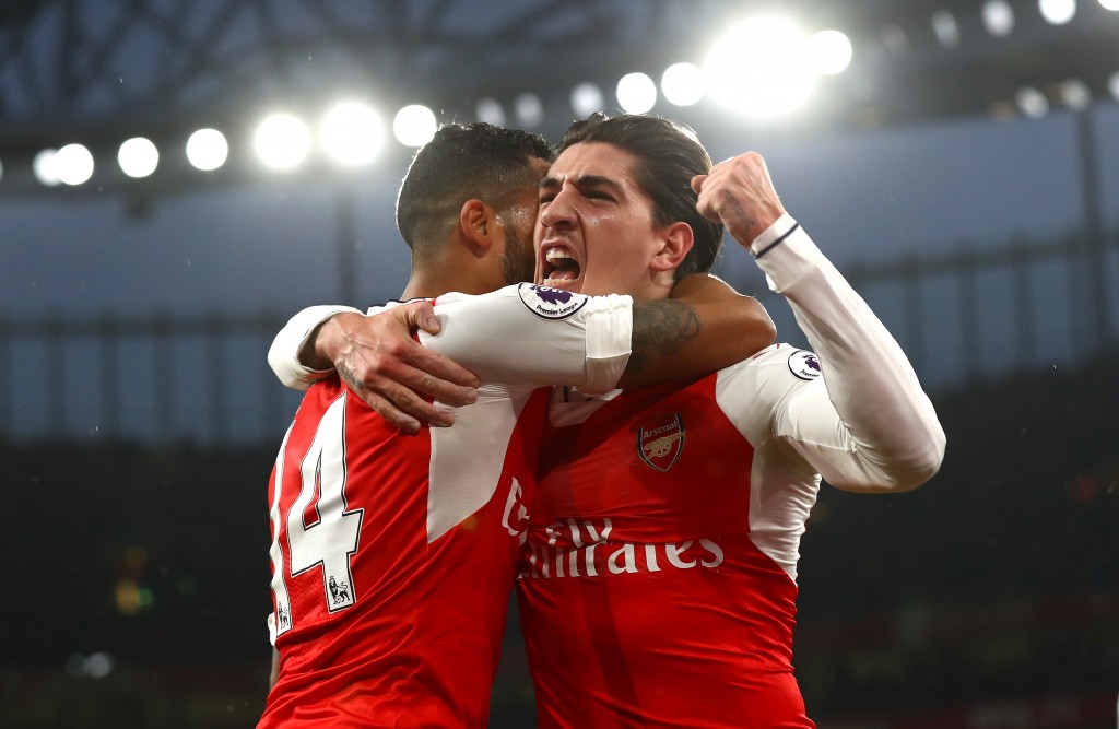 LONDON, ENGLAND - DECEMBER 10: Theo Walcott of Arsenal (L) celebrates scoring his sides first goal with Hector Bellerin of Arsenal (R) during the Premier League match between Arsenal and Stoke City at the Emirates Stadium on December 10, 2016 in London, England. (Photo by Clive Rose/Getty Images)