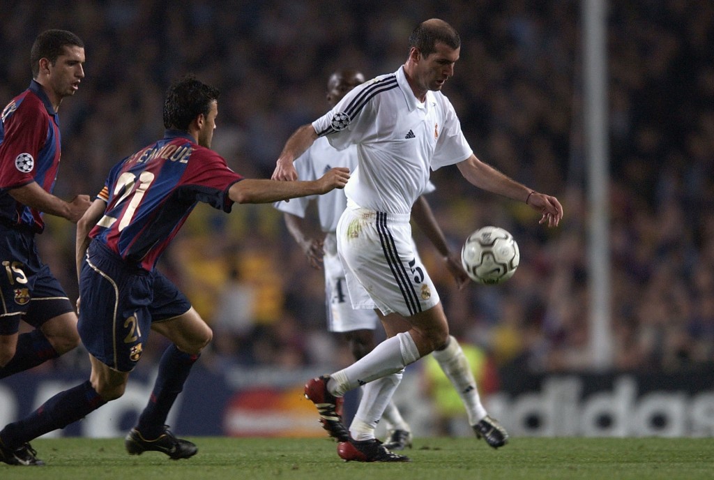 23 Apr 2002: Zinedine Zidane of Real Madrid is pursued by Luis Enrique of Barcelona during the UEFA Champions League Semi Final First Leg match between Barcelona and Real Madrid at the Nou Camp, Barcelona, Spain. DIGITAL IMAGE Mandatory Credit: Clive Brunskill/Getty Images