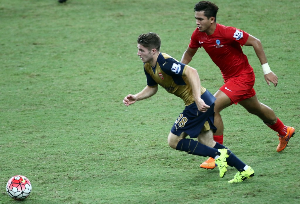 SINGAPORE - JULY 15: Dan Crowley of Arsenal competes with Zulfahmi Arifin of Singapore during the Barclays Asia Trophy match between Arsenal and Singapore at National Stadium on July 15, 2015 in Singapore. (Photo by Stanley Chou/Getty Images)