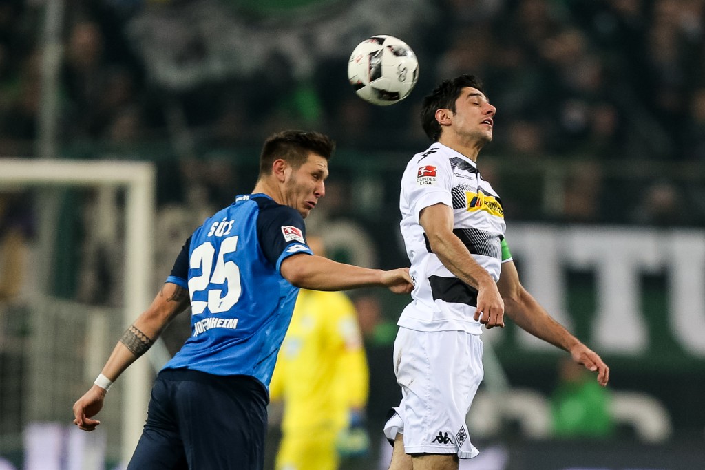 MOENCHENGLADBACH, GERMANY - NOVEMBER 26: Lars Stindl (R) of Moenchengladbach battles for the ball with Niklas Suele of Hoffenheim during the Bundesliga match between Borussia Moenchengladbach and TSG 1899 Hoffenheim at Borussia-Park on November 26, 2016 in Moenchengladbach, Germany. (Photo by Maja Hitij/Bongarts/Getty Images)
