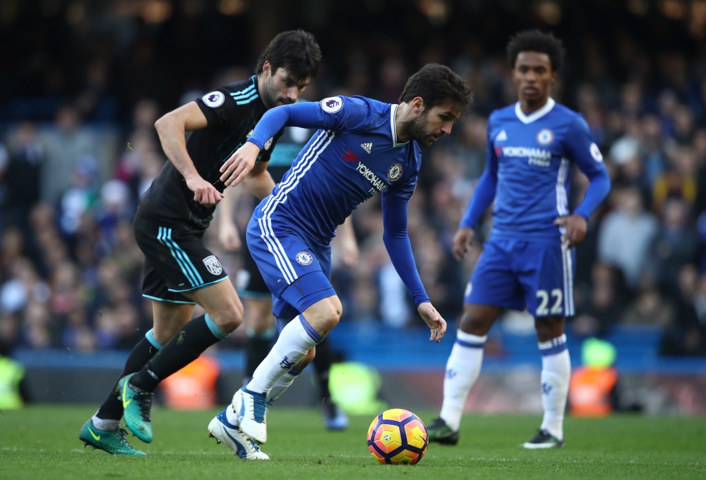 LONDON, ENGLAND - DECEMBER 11: Cesc Fabregas of Chelsea controls the ball under pressure of Claudio Yacob of West Bromwich Albion during the Premier League match between Chelsea and West Bromwich Albion at Stamford Bridge on December 11, 2016 in London, England. (Photo by Julian Finney/Getty Images)