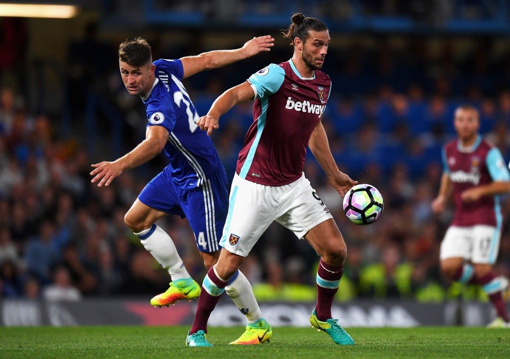 LONDON, ENGLAND - AUGUST 15: Gary Cahill of Chelsea challenges Andy Carroll of West Ham United during the Premier League match between Chelsea and West Ham United at Stamford Bridge on August 15, 2016 in London, England. (Photo by Mike Hewitt/Getty Images)