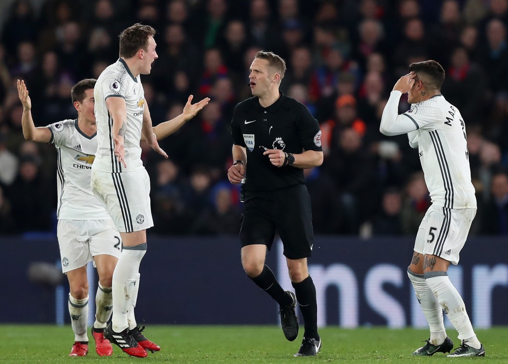 LONDON, ENGLAND - DECEMBER 14: Phil Jones of Manchester United (L) and Marcos Rojo of Manchester United (R) argue with the referee after there was no penalty given during the Premier League match between Crystal Palace and Manchester United at Selhurst Park on December 14, 2016 in London, England. (Photo by Christopher Lee/Getty Images)