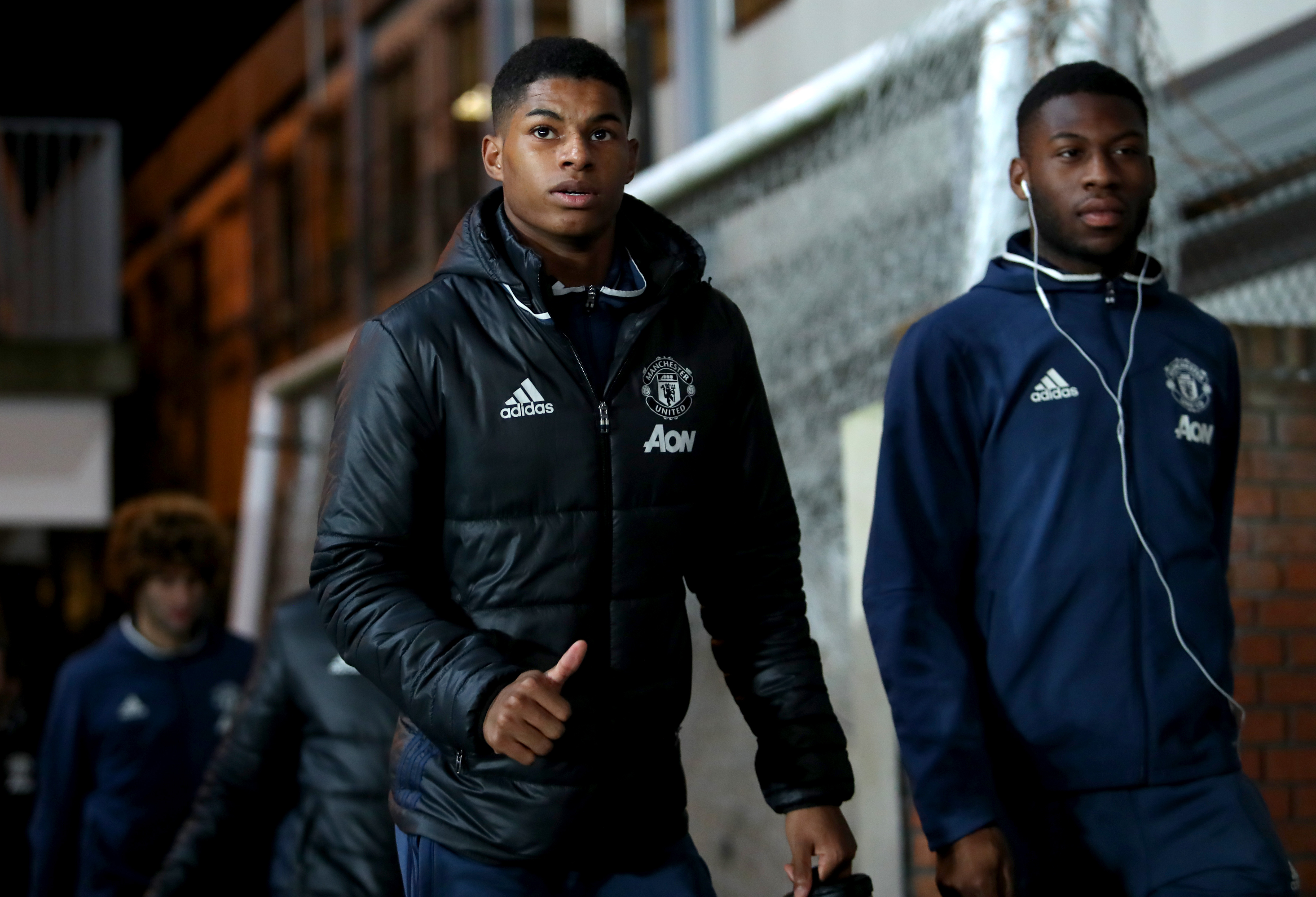 LONDON, ENGLAND - DECEMBER 14: Marcus Rashford (L) of Manchester United thumbs up on arrival at the stadium prior to the Premier League match between Crystal Palace and Manchester United at Selhurst Park on December 14, 2016 in London, England. (Photo by Christopher Lee/Getty Images)