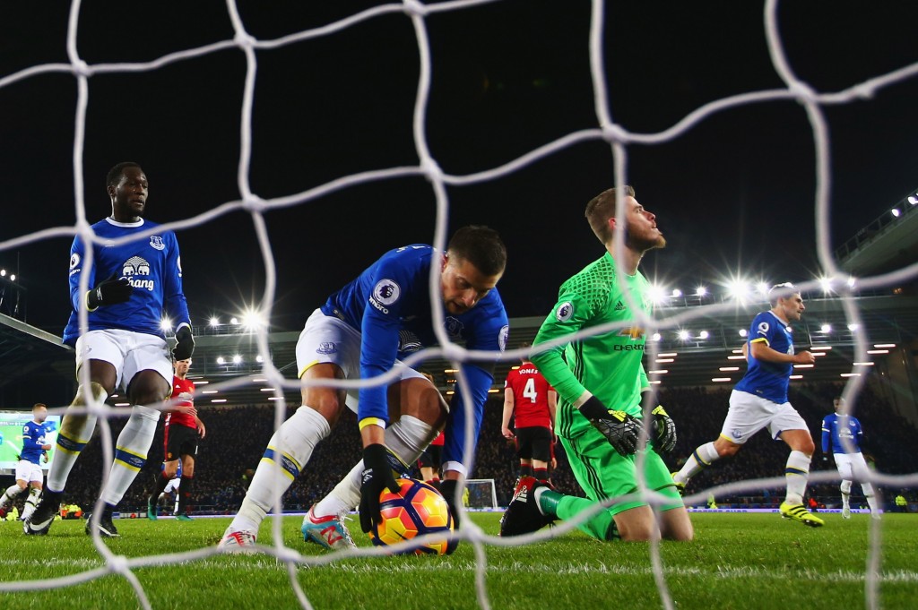 LIVERPOOL, ENGLAND - DECEMBER 04: Kevin Mirallas of Everton collects the ball as David De Gea of Manchester United looks dejected as Leighton Baines of Everton scores their first and equalising goal from the penalty spot during the Premier League match between Everton and Manchester United at Goodison Park on December 4, 2016 in Liverpool, England. (Photo by Clive Brunskill/Getty Images)