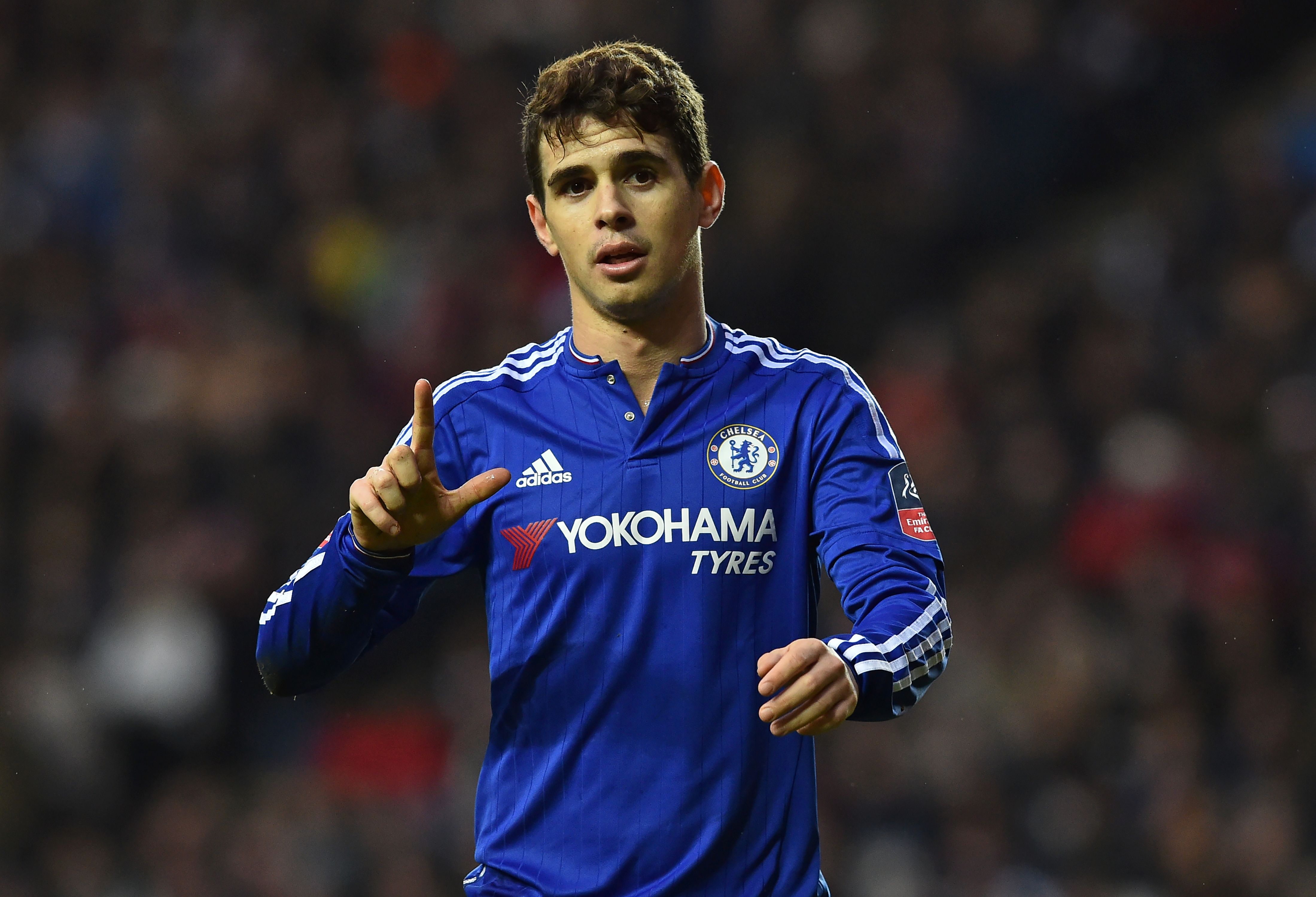 Chelsea's Brazilian midfielder Oscar celebrates after scoring his second goal during the English FA Cup fourth round football match between MK Dons and Chelsea at Stadium MK in Milton Keynes, central England, on January 31, 2016. / AFP / BEN STANSALL / RESTRICTED TO EDITORIAL USE. No use with unauthorized audio, video, data, fixture lists, club/league logos or 'live' services. Online in-match use limited to 75 images, no video emulation. No use in betting, games or single club/league/player publications. / (Photo credit should read BEN STANSALL/AFP/Getty Images)