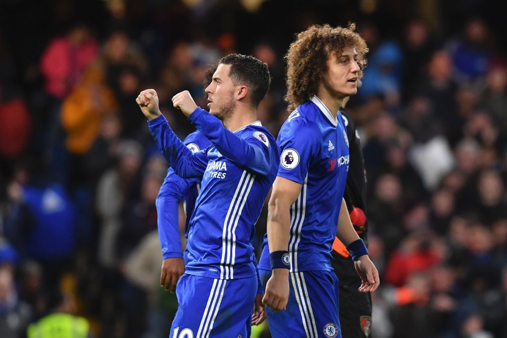 Chelsea's Belgian midfielder Eden Hazard (L) celebrates scoring their second goal from teh penalty spot during the English Premier League football match between Chelsea and Bournemouth at Stamford Bridge in London on December 26, 2016. (Photo by Ben Stansall/AFP/Getty Images)