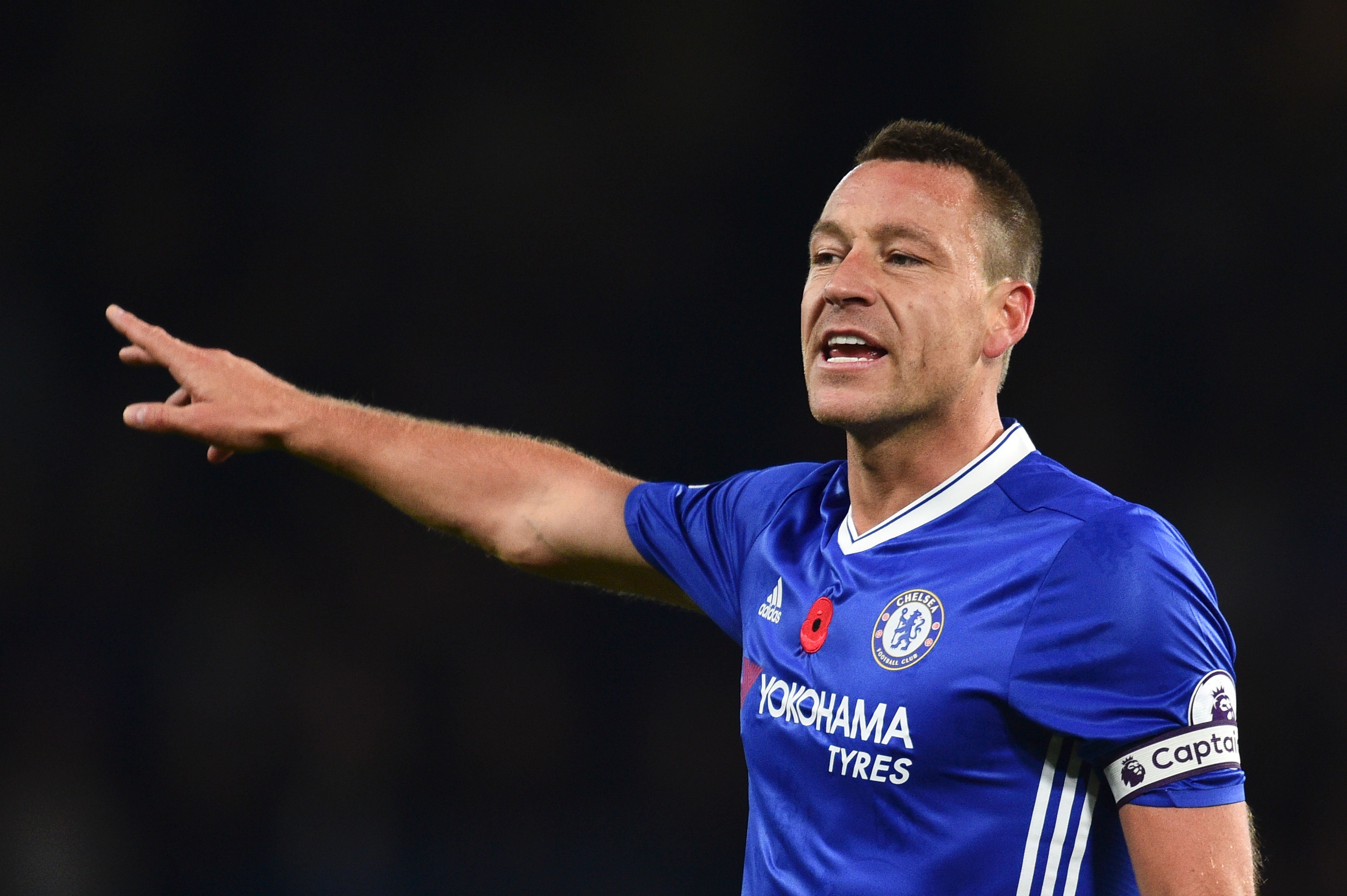 Chelsea's English defender John Terry gestures during the English Premier League football match between Chelsea and Everton at Stamford Bridge in London on November 5, 2016.
Chelsea won the game 5-0. / AFP / Glyn KIRK / RESTRICTED TO EDITORIAL USE. No use with unauthorized audio, video, data, fixture lists, club/league logos or 'live' services. Online in-match use limited to 75 images, no video emulation. No use in betting, games or single club/league/player publications. / (Photo credit should read GLYN KIRK/AFP/Getty Images)