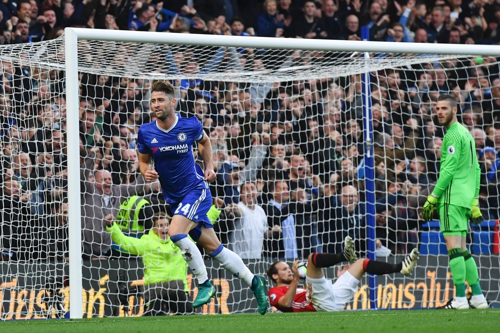 Chelsea's English defender Gary Cahill (L) celebrates after scoring their second goal during the English Premier League football match between Chelsea and Manchester United at Stamford Bridge in London on October 23, 2016. / AFP / Ben STANSALL / RESTRICTED TO EDITORIAL USE. No use with unauthorized audio, video, data, fixture lists, club/league logos or 'live' services. Online in-match use limited to 75 images, no video emulation. No use in betting, games or single club/league/player publications. / (Photo credit should read BEN STANSALL/AFP/Getty Images)