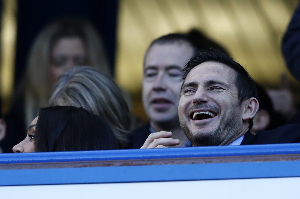 Chelsea legend Frank Lampard laughs as he awaits kick-off in the English Premier League football match between Chelsea and West Bromwich Albion at Stamford Bridge in London on December 11, 2016. / AFP / Adrian DENNIS / RESTRICTED TO EDITORIAL USE. No use with unauthorized audio, video, data, fixture lists, club/league logos or 'live' services. Online in-match use limited to 75 images, no video emulation. No use in betting, games or single club/league/player publications. / (Photo credit should read ADRIAN DENNIS/AFP/Getty Images)