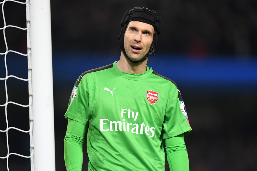Arsenal's Czech goalkeeper Petr Cech reacts after conceding their second goal during the English Premier League football match between Manchester City and Arsenal at the Etihad Stadium in Manchester, north west England, on December 18, 2016. / AFP / Paul ELLIS / RESTRICTED TO EDITORIAL USE. No use with unauthorized audio, video, data, fixture lists, club/league logos or 'live' services. Online in-match use limited to 75 images, no video emulation. No use in betting, games or single club/league/player publications. / (Photo credit should read PAUL ELLIS/AFP/Getty Images)