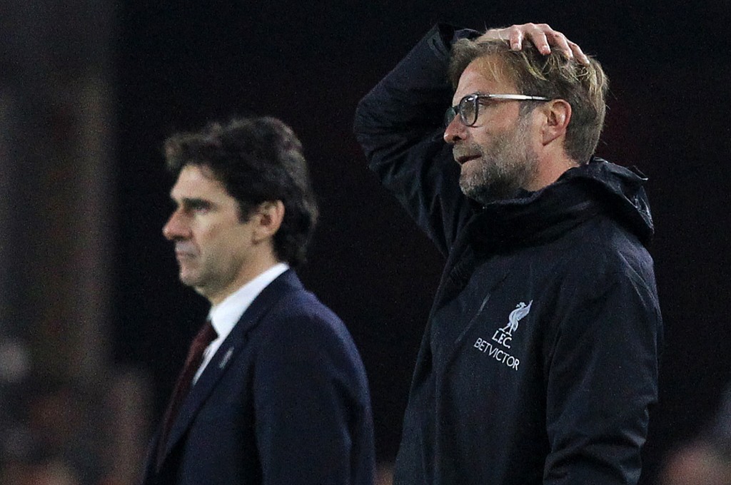 Middlesbrough's Spanish manager Aitor Karanka (L) and Liverpool's German manager Jurgen Klopp watch the players from the touchline during the English Premier League football match between Middlesbrough and Liverpool at Riverside Stadium in Middlesbrough, northeast England on December 14, 2016. / AFP / Lindsey PARNABY / RESTRICTED TO EDITORIAL USE. No use with unauthorized audio, video, data, fixture lists, club/league logos or 'live' services. Online in-match use limited to 75 images, no video emulation. No use in betting, games or single club/league/player publications. / (Photo credit should read LINDSEY PARNABY/AFP/Getty Images)