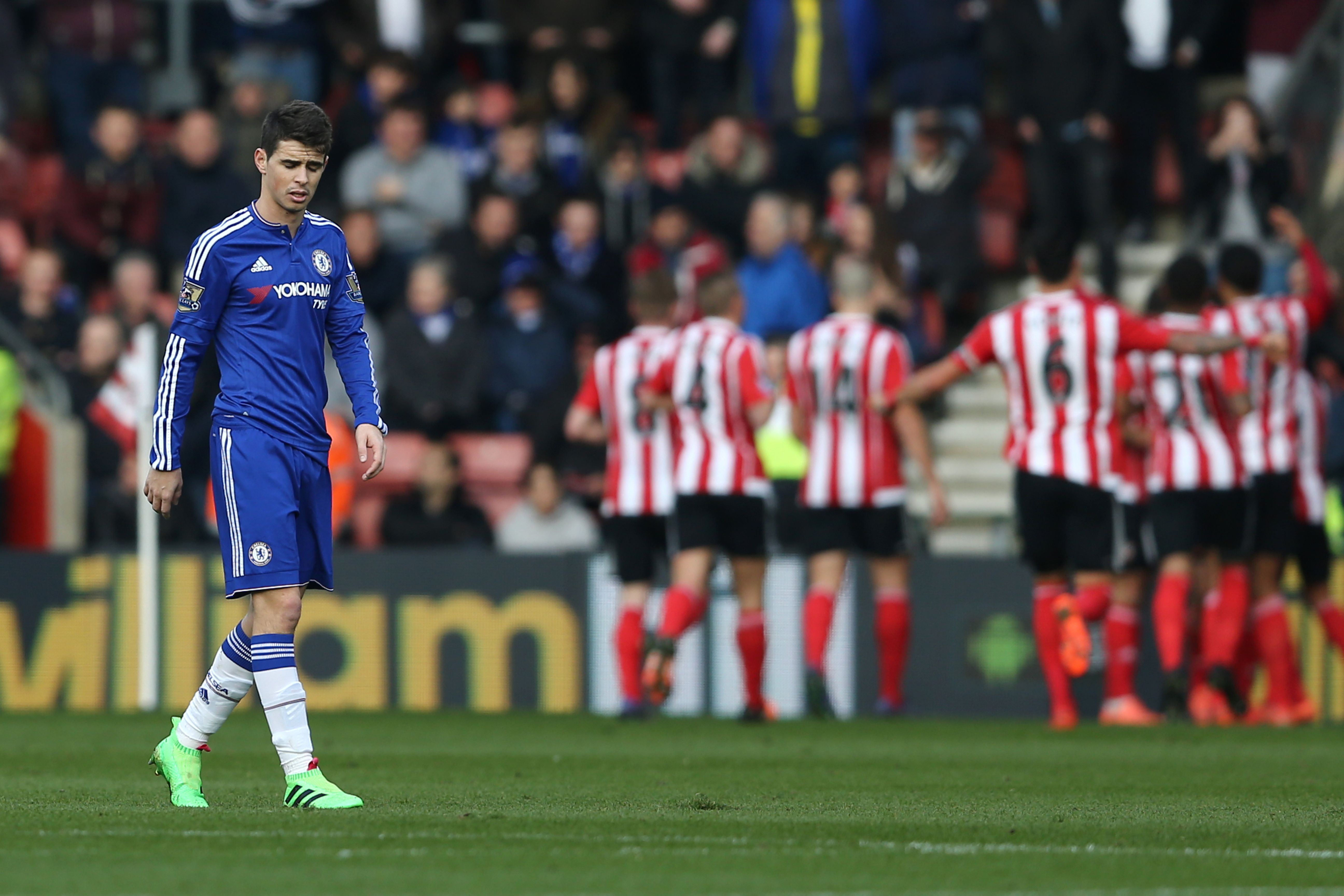 Chelsea's Brazilian midfielder Oscar (L) reacts after Southampton scored the opening goal during the English Premier League football match between Southampton and Chelsea at St Mary's Stadium in Southampton, southern England on February 27, 2016. / AFP / JUSTIN TALLIS / RESTRICTED TO EDITORIAL USE. No use with unauthorized audio, video, data, fixture lists, club/league logos or 'live' services. Online in-match use limited to 75 images, no video emulation. No use in betting, games or single club/league/player publications. / (Photo credit should read JUSTIN TALLIS/AFP/Getty Images)
