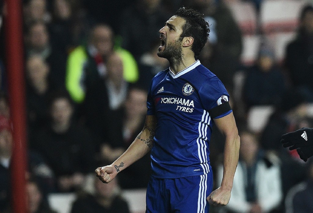 Chelsea's Spanish midfielder Cesc Fabregas celebrates scoring his team's first goal during the English Premier League football match between Sunderland and Chelsea at the Stadium of Light in Sunderland, north-east England on December 14, 2016. / AFP / Oli SCARFF / RESTRICTED TO EDITORIAL USE. No use with unauthorized audio, video, data, fixture lists, club/league logos or 'live' services. Online in-match use limited to 75 images, no video emulation. No use in betting, games or single club/league/player publications. / (Photo credit should read OLI SCARFF/AFP/Getty Images)