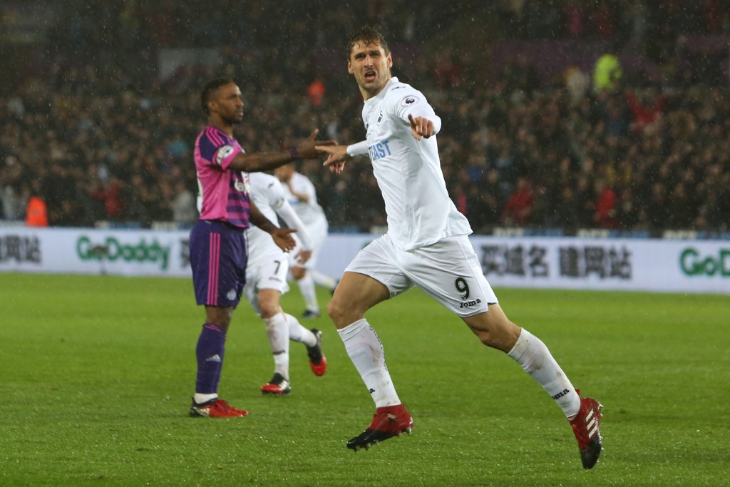 Swansea City's Spanish striker Fernando Llorente celebrates after scoring their second goal during the English Premier League football match between Swansea City and Sunderland at The Liberty Stadium in Swansea, south Wales on December 10, 2016. / AFP / Geoff CADDICK / RESTRICTED TO EDITORIAL USE. No use with unauthorized audio, video, data, fixture lists, club/league logos or 'live' services. Online in-match use limited to 75 images, no video emulation. No use in betting, games or single club/league/player publications. / (Photo credit should read GEOFF CADDICK/AFP/Getty Images)