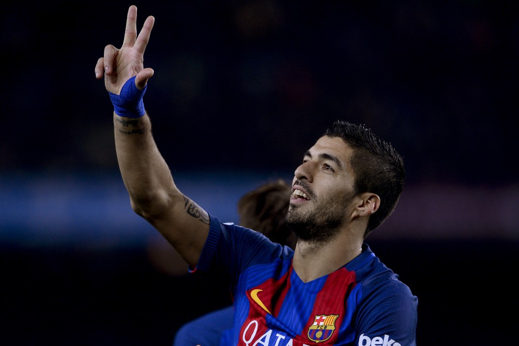 Barcelona's Uruguayan forward Luis Suarez celebrates his goal during the Spanish league football match FC Barcelona vs RCD Espanyol at the Camp Nou stadium in Barcelona on December 18, 2016. / AFP / JOSEP LAGO (Photo credit should read JOSEP LAGO/AFP/Getty Images)