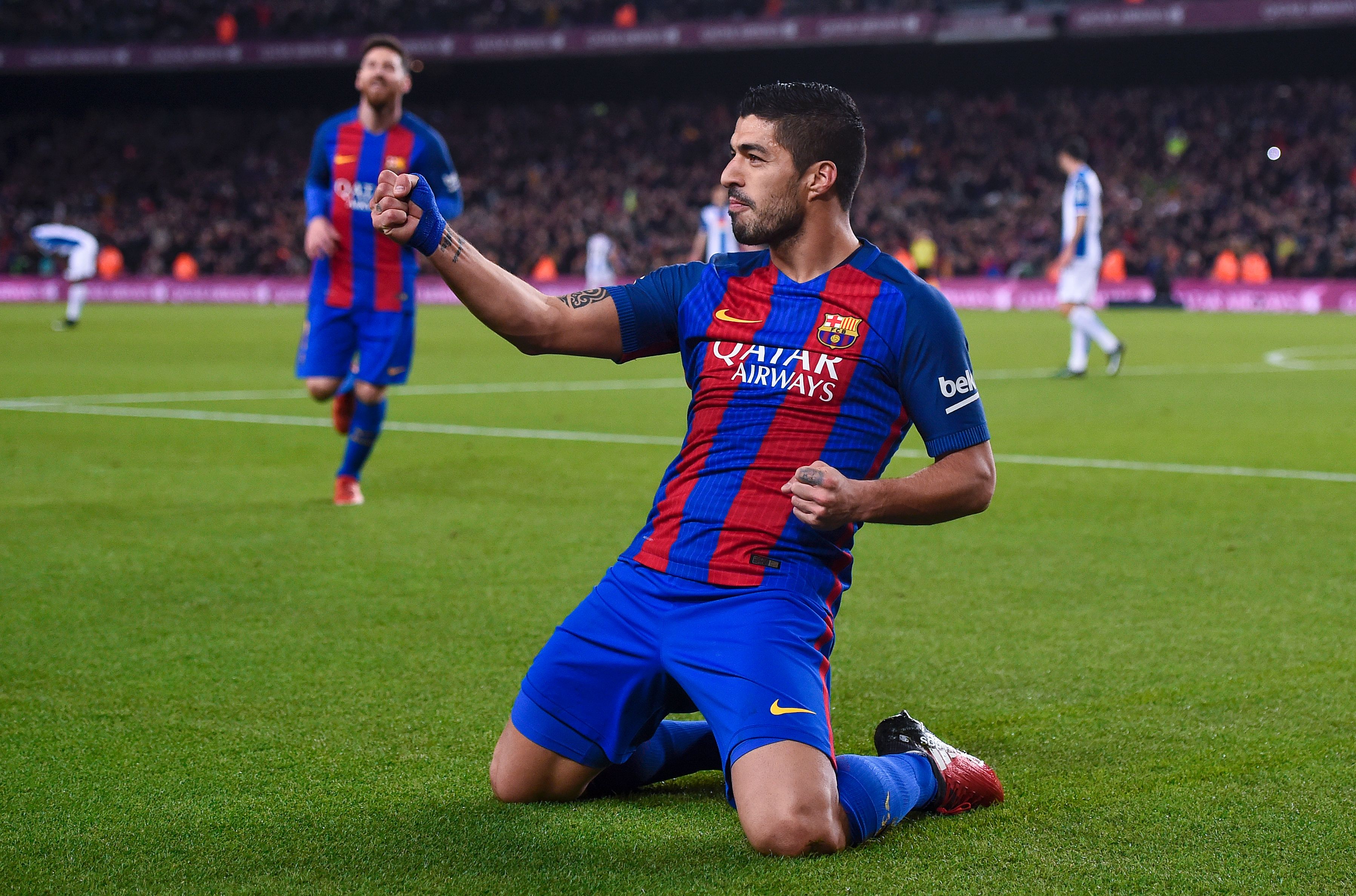 Barcelona's Uruguayan forward Luis Suarez celebrates a goal during the Spanish league football match FC Barcelona vs RCD Espanyol at the Camp Nou stadium in Barcelona on December 18, 2016. / AFP / JOSEP LAGO (Photo credit should read JOSEP LAGO/AFP/Getty Images)