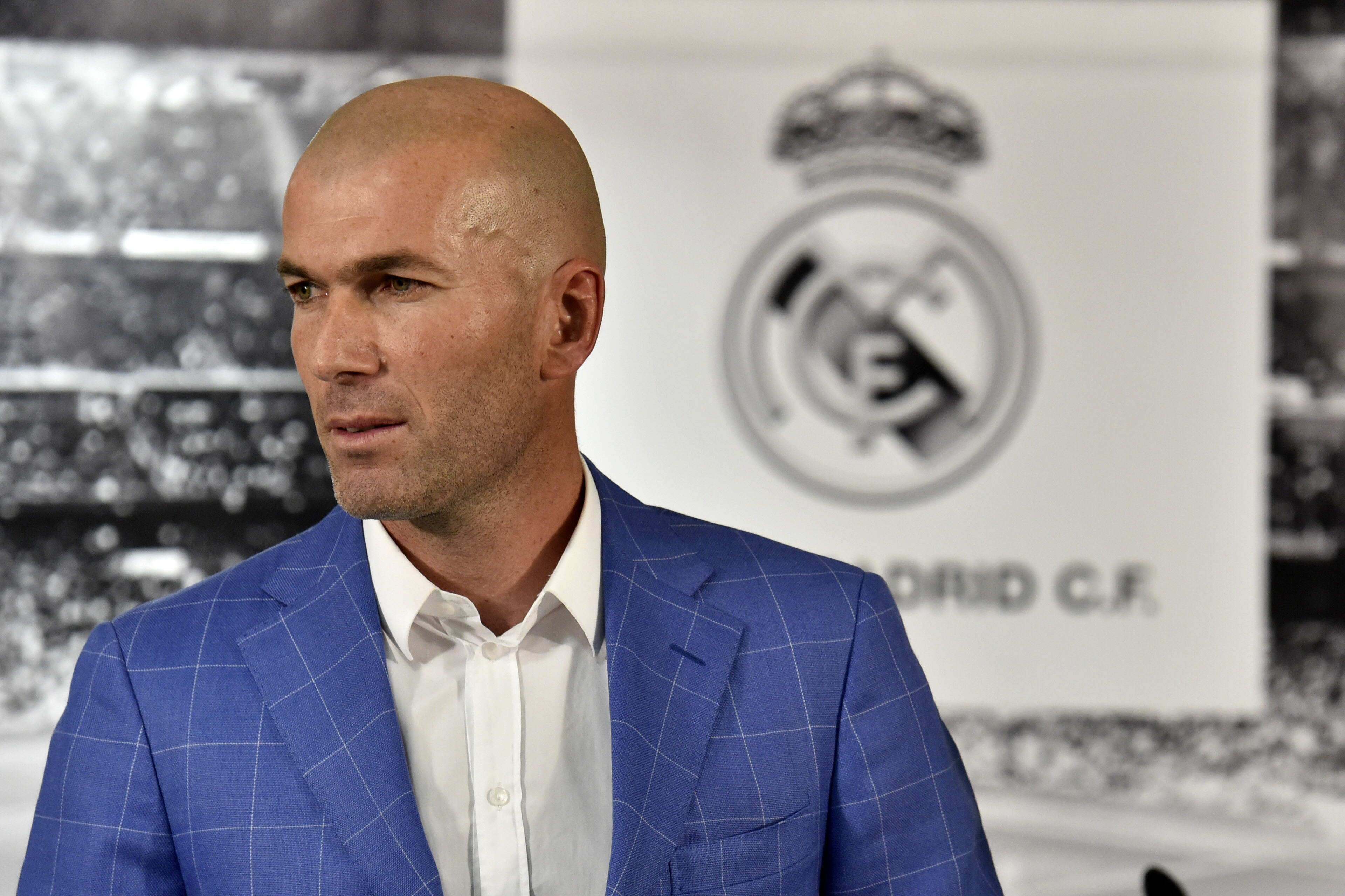 Real Madrid's new French coach Zinedine Zidane poses after a statement of Real Madrid's president at the Santiago Bernabeu stadium in Madrid on January 4, 2016. Rafael Benitez's unhappy reign in charge of Real Madrid came to an end after just seven months and 25 games when he was sacked and replaced by club legend Zinedine Zidane today. AFP PHOTO/ GERARD JULIEN / AFP / GERARD JULIEN (Photo credit should read GERARD JULIEN/AFP/Getty Images)