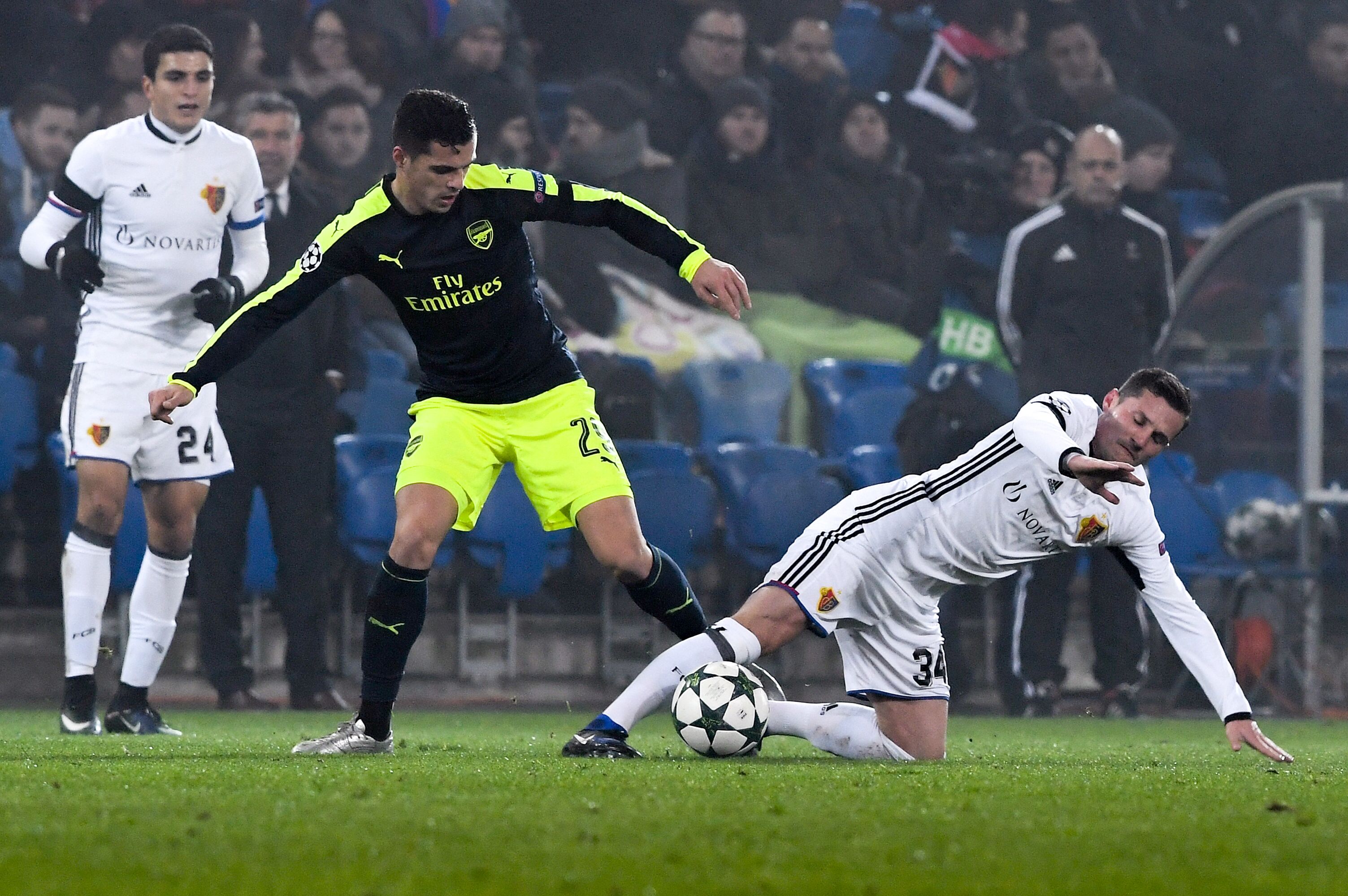 Arsenal's Swiss midfielder Granit Xhaka (C) vies with Basel's Albanian midfielder Taulant Xhaka during the UEFA Champions league Group A football match between FC Basel 1893 and Arsenal FC on December 6, 2016 at the St Jakob Park stadium in Basel. / AFP / Patrick HERTZOG (Photo credit should read PATRICK HERTZOG/AFP/Getty Images)
